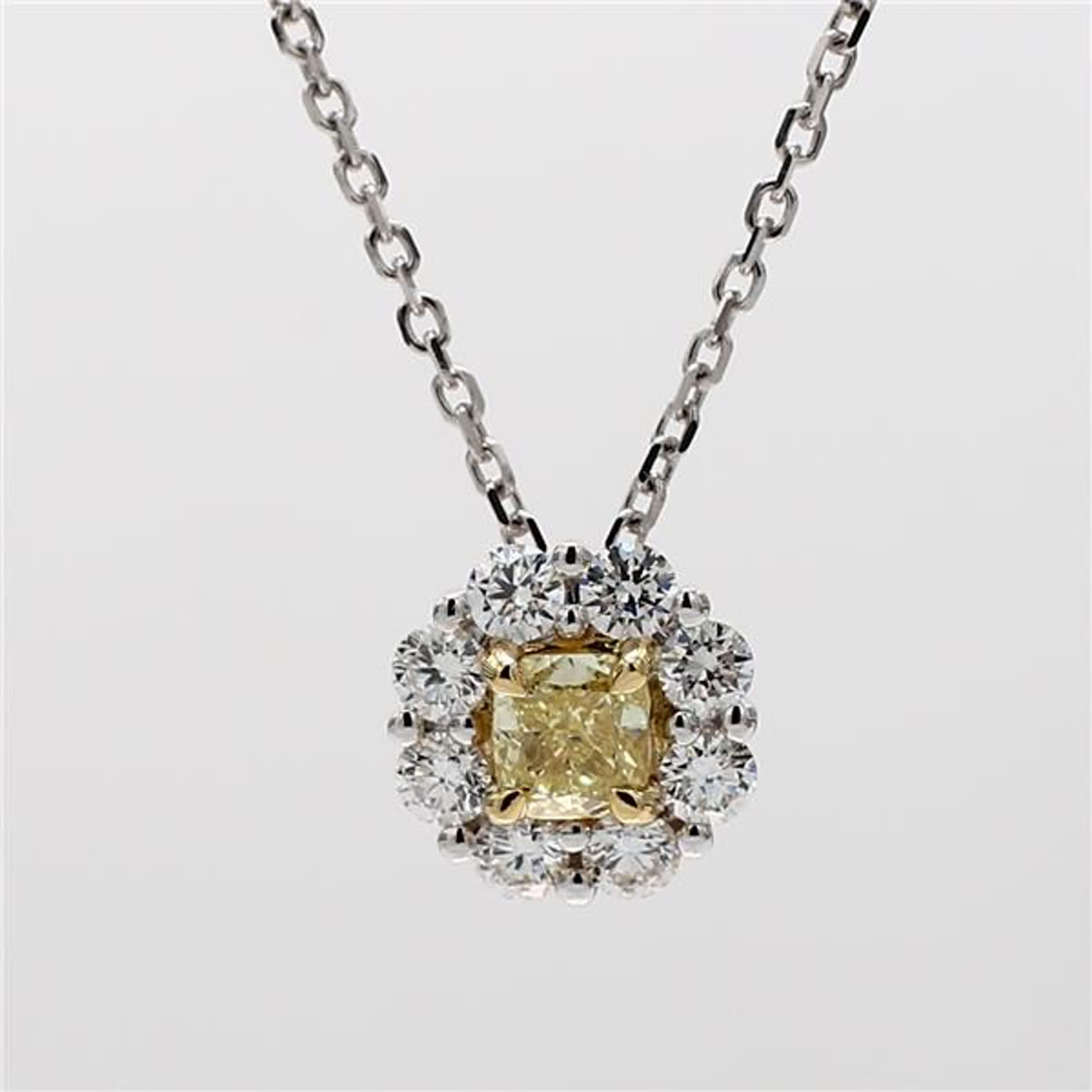 RareGemWorld's intriguing diamond pendant. Mounted in a beautiful 18K Yellow and White Gold setting with a natural cushion cut yellow diamond. The yellow diamond is surrounded by small round natural white diamond melee in a beautiful single halo.