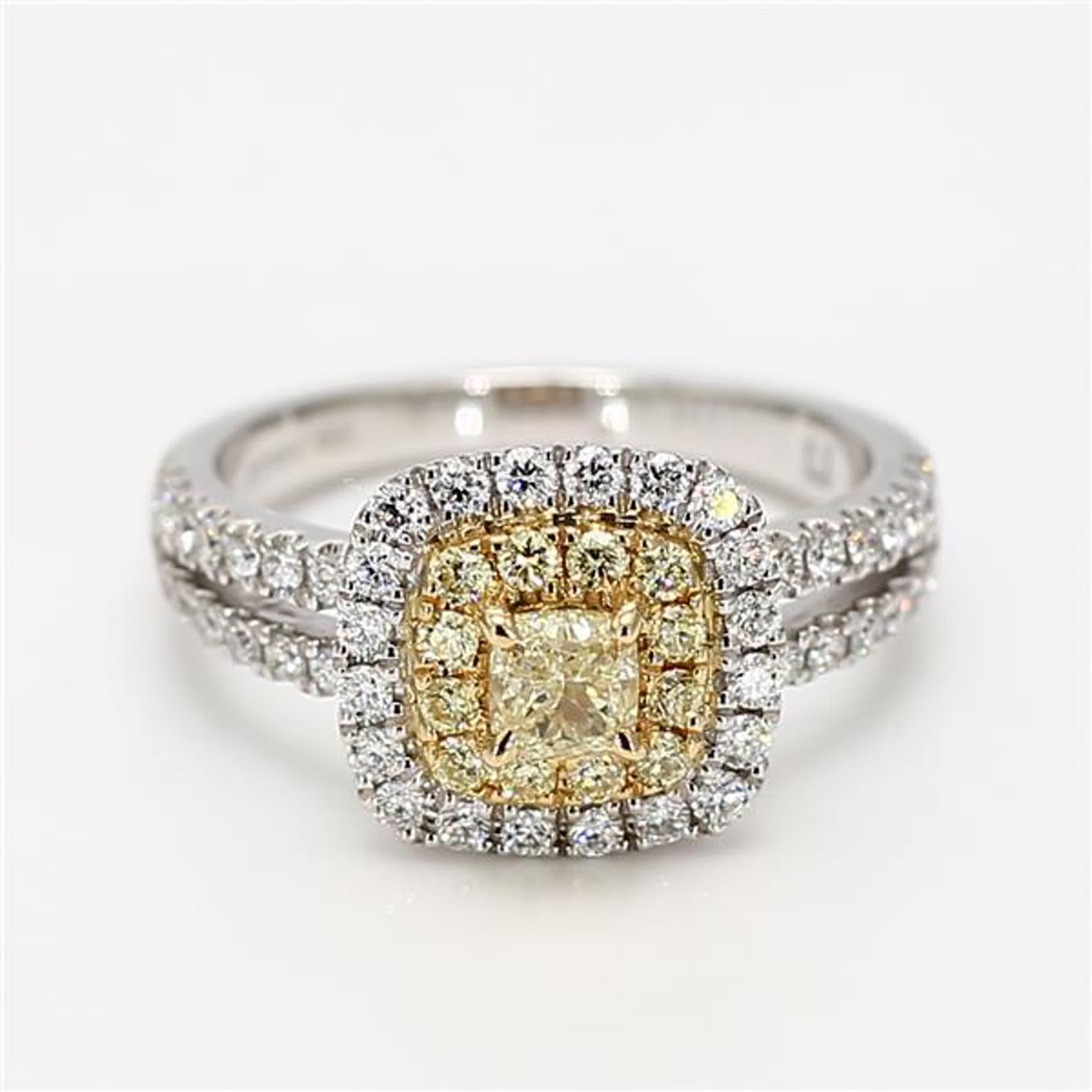 RareGemWorld's classic diamond ring. Mounted in a beautiful 18K Gold and Platinum setting with a natural cushion cut yellow diamond. The yellow diamond is surrounded by small round natural white diamond melee and small round natural yellow diamond