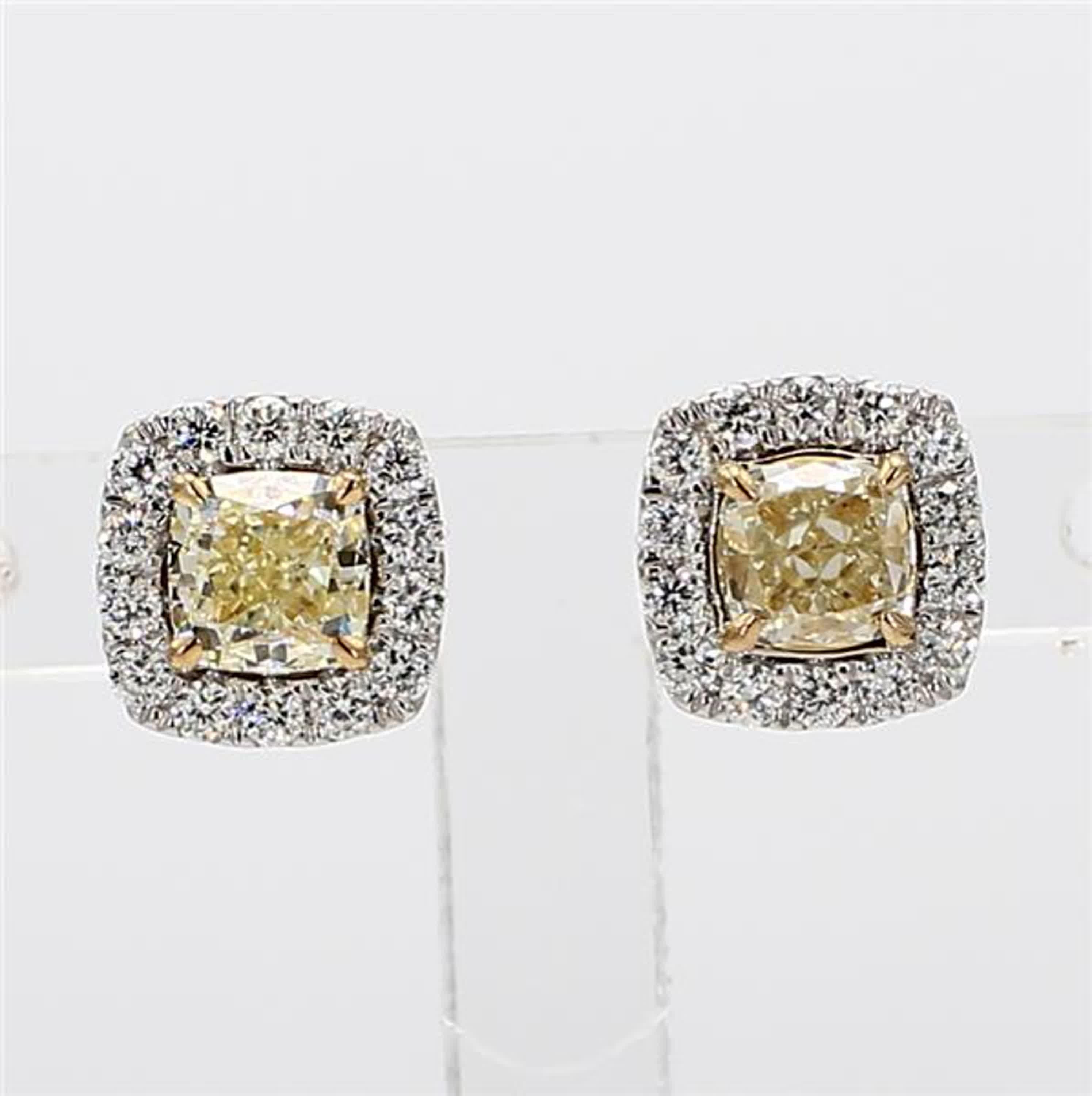 RareGemWorld's classic diamond earrings. Mounted in a beautiful 18K Yellow and White Gold setting with natural cushion cut yellow diamonds. The yellow diamonds are surrounded by round natural white diamond melee. These earrings are guaranteed to