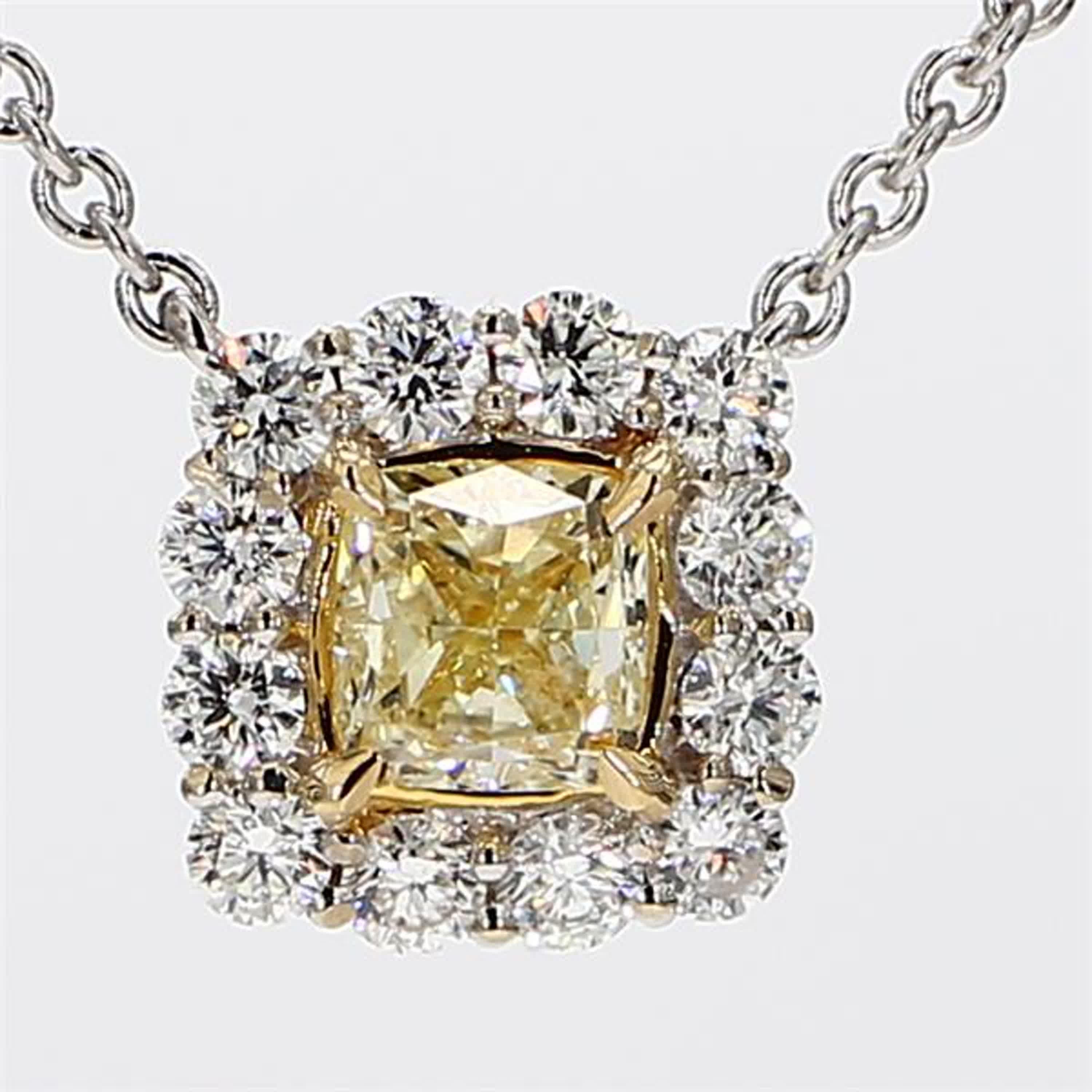 RareGemWorld's intriguing diamond pendant. Mounted in a beautiful 18K Yellow and White Gold setting with a natural cushion cut yellow diamond. The yellow diamond is surrounded by small round natural white diamond melee. This pendant is guaranteed to