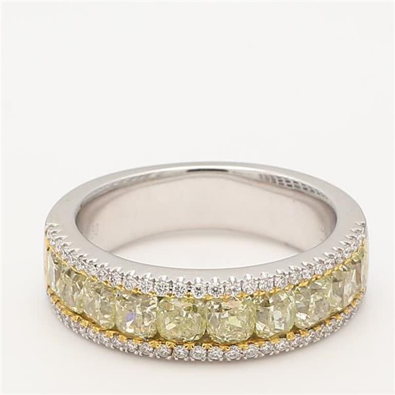 RareGemWorld's classic diamond band. Mounted in a beautiful 18K Yellow and White Gold setting with natural cushion cut yellow diamonds complimented by natural round cut white diamonds. This band is guaranteed to impress and enhance your personal