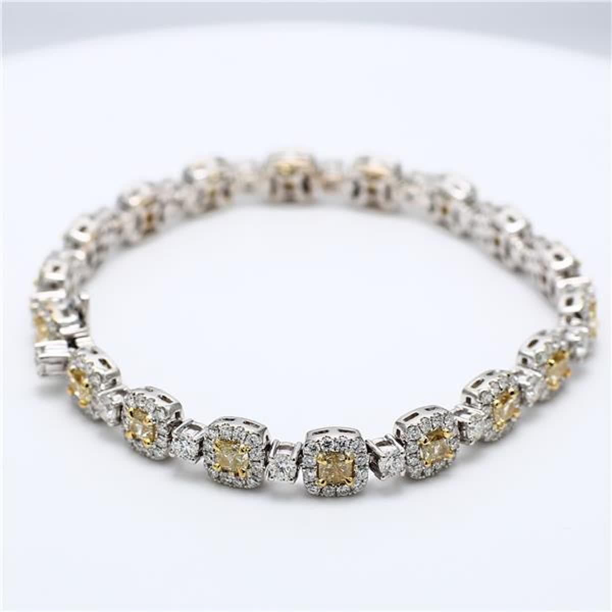 RareGemWorld's classic diamond bracelet. Mounted in a beautiful 18K Yellow and White Gold setting with natural cushion cut yellow diamonds. The yellow diamonds are surrounded by small round natural white diamond melee as well as diamonds continuing