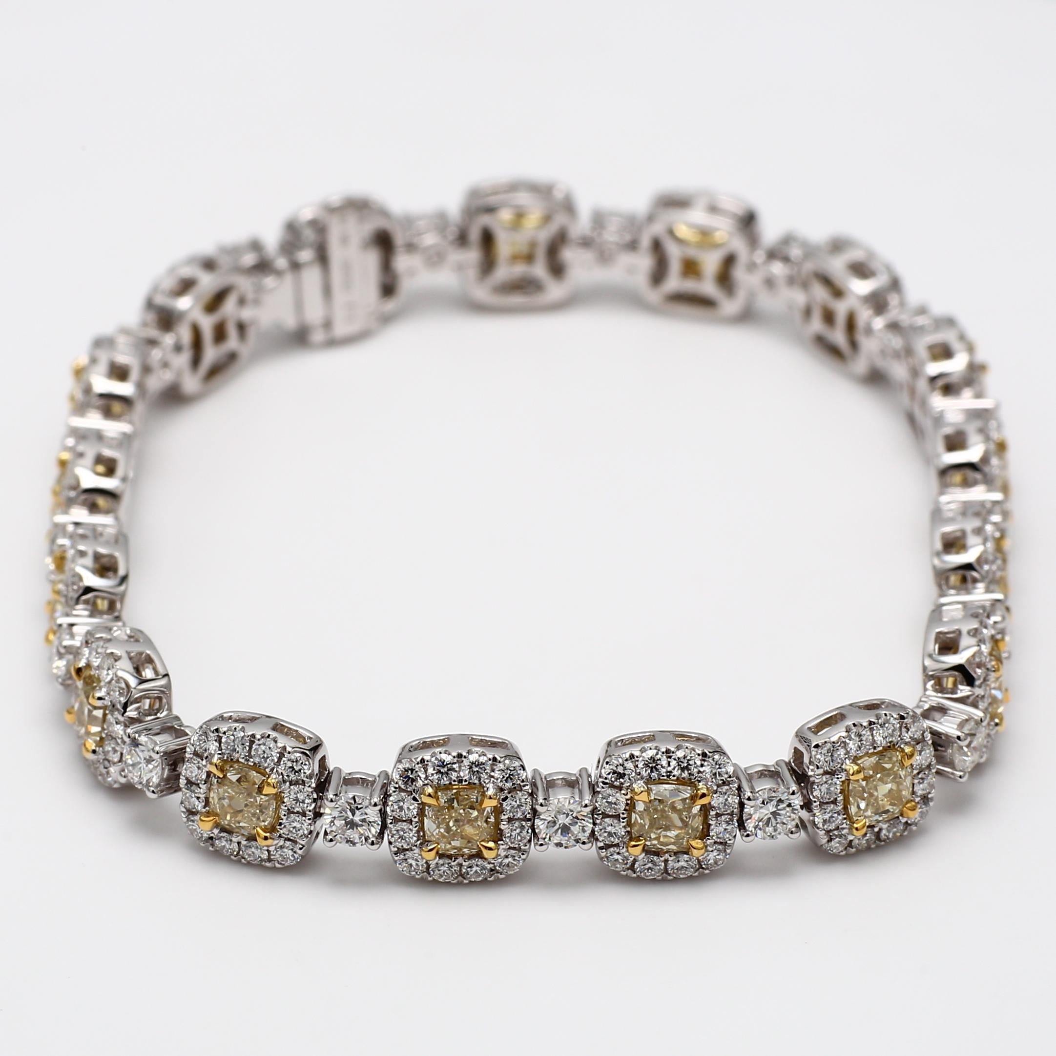 RareGemWorld's classic diamond bracelet. Mounted in a beautiful 18K Yellow and White Gold setting with natural cushion cut yellow diamonds. The yellow diamonds are surrounded by small round natural white diamond melee as well as diamonds continuing