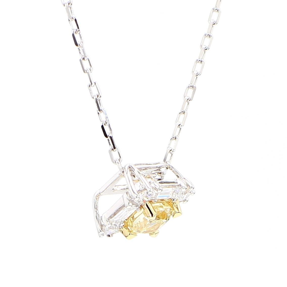 RareGemWorld's beautiful diamond pendant. Mounted in a beautiful 18K Yellow and White Gold setting with a natural cushion cut yellow diamond. The yellow diamond is surrounded by round natural white diamond melee and natural baguette cut white