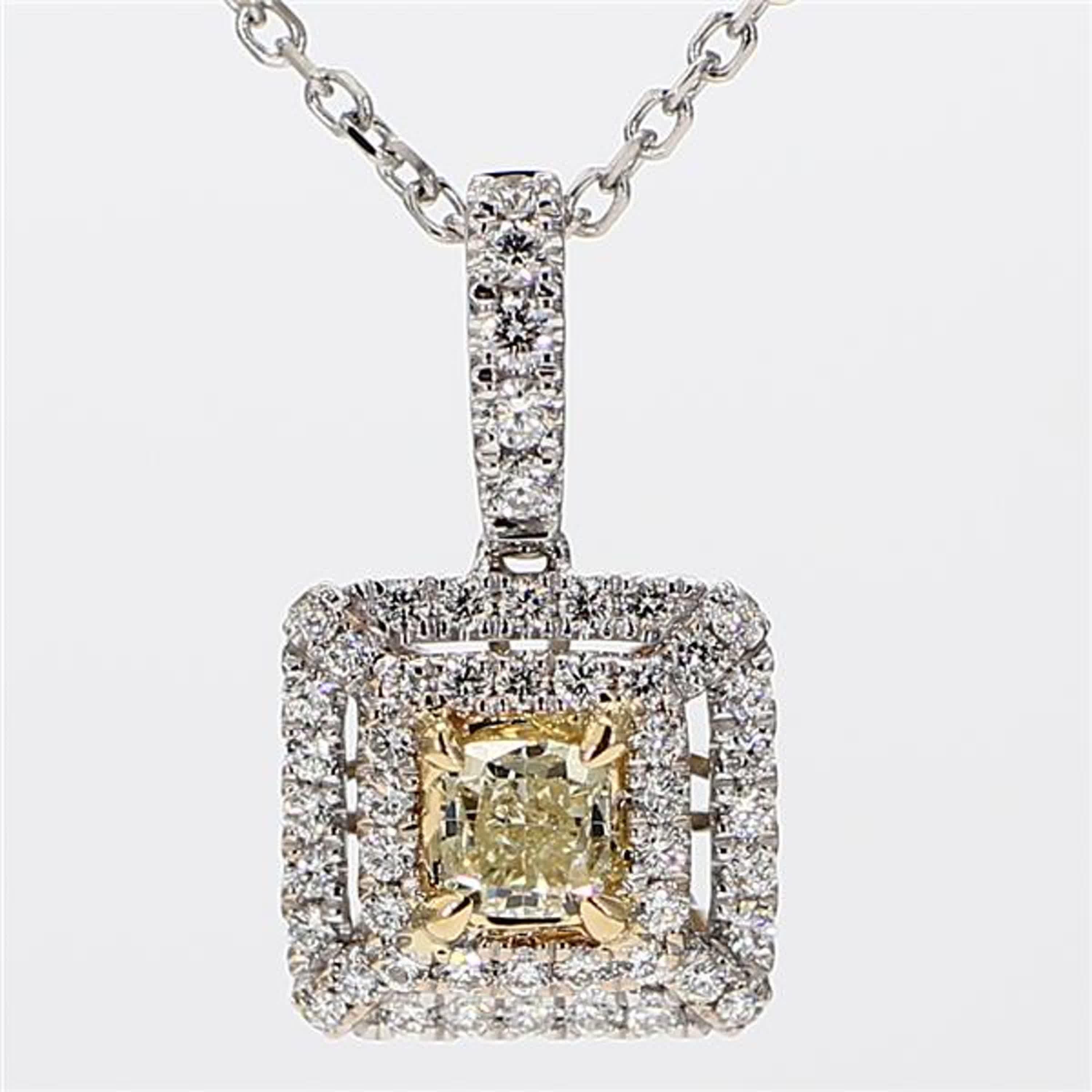 RareGemWorld's intriguing diamond pendant. Mounted in a beautiful 18K Yellow and White Gold setting with a natural cushion cut yellow diamond. The yellow diamond is surrounded by round natural white diamond melee. This pendant is guaranteed to