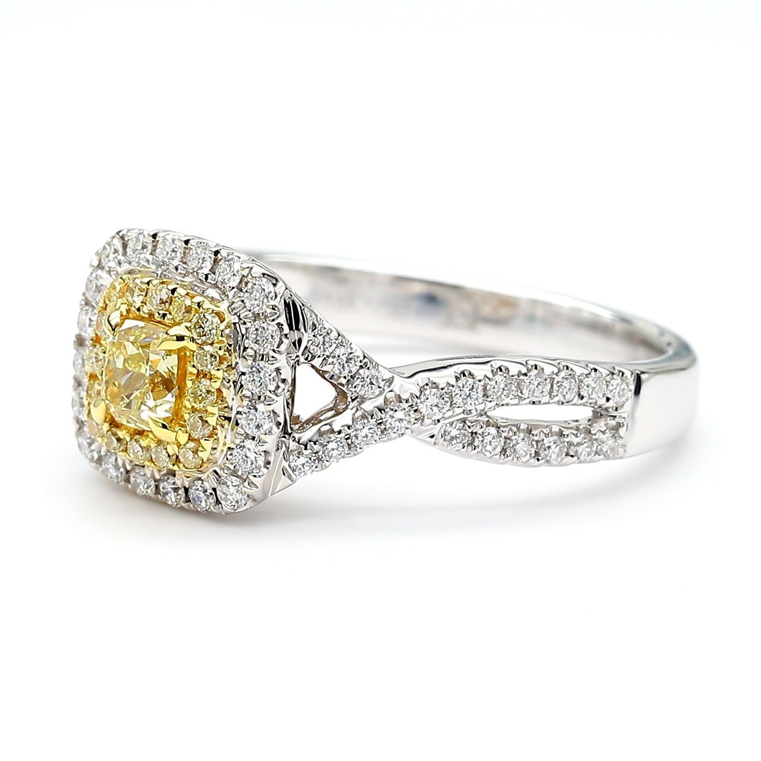 RareGemWorld's beautiful diamond ring. Mounted in a beautiful 18K Yellow and White Gold setting with a natural cushion cut yellow diamond. The yellow diamond is surrounded by round natural yellow diamond melee and round natural white diamond melee.