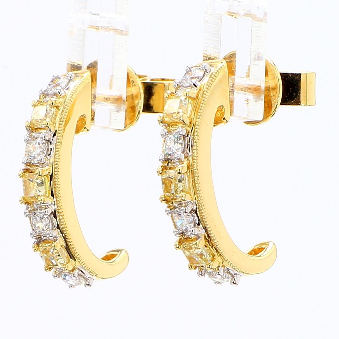 RareGemWorld's classic diamond earrings. Mounted in a beautiful 18K Yellow and White Gold setting with natural cushion cut yellow diamonds. The yellow diamonds are surrounded by round natural white diamond melee. These earrings are guaranteed to