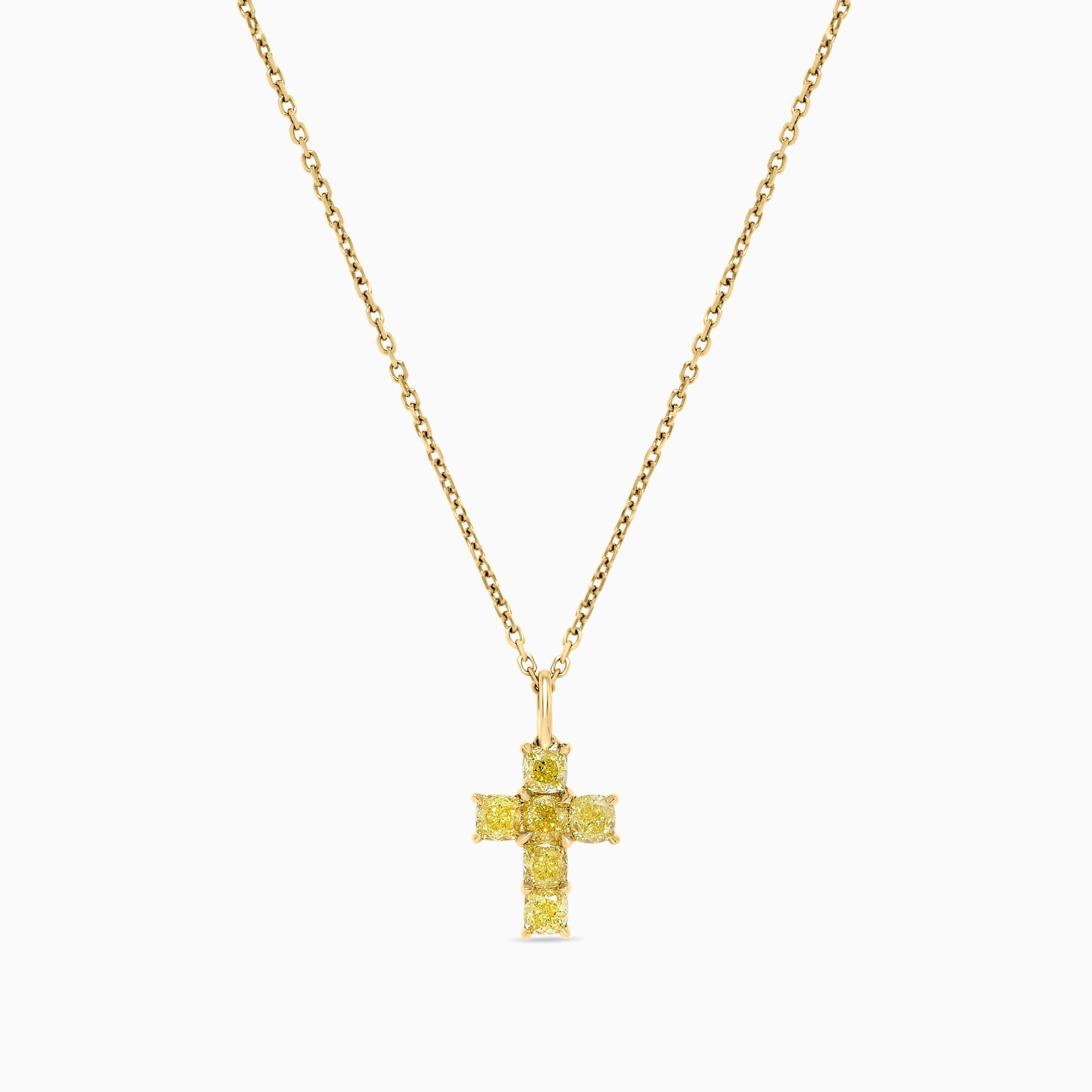 RareGemWorld's classic diamond pendant. Mounted in a beautiful 18K Yellow Gold setting with natural cushion cut yellow diamonds in a beautiful cross format. This pendant is guaranteed to impress and enhance your personal collection!

Total Weight:
