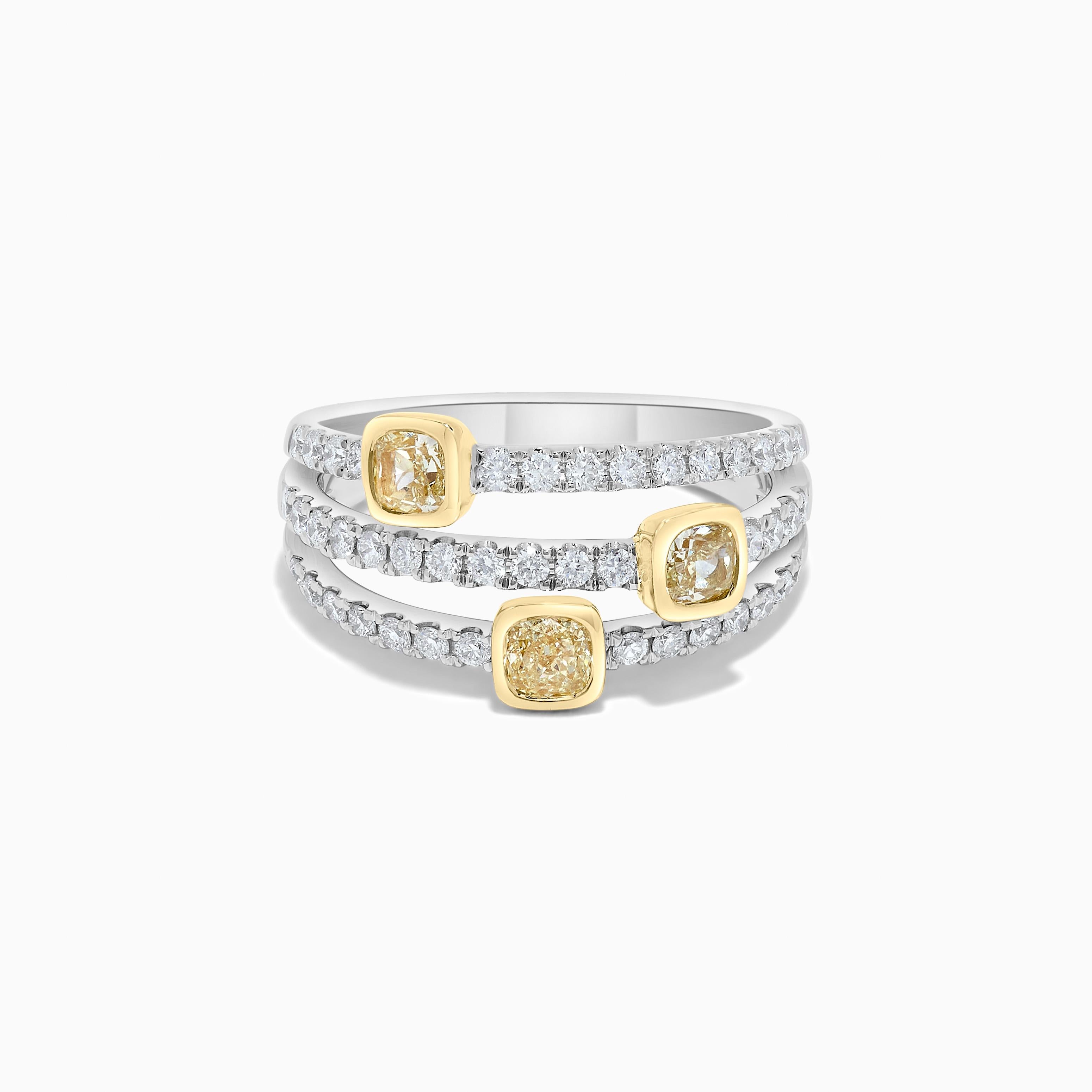 RareGemWorld's classic diamond band. Mounted in a beautiful 18K Yellow and White Gold setting with natural cushion cut yellow diamonds complimented by natural round cut white diamonds. This band is guaranteed to impress and enhance your personal