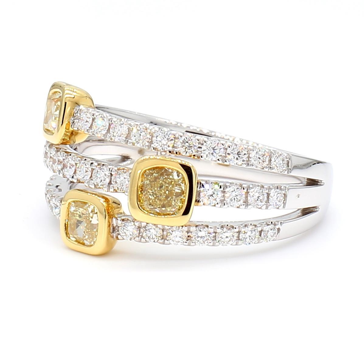 RareGemWorld's beautiful diamond band. Mounted in a beautiful 18K Yellow and White Gold setting with natural cushion cut yellow diamonds complimented by natural round cut white diamonds. This band is guaranteed to impress and enhance your personal