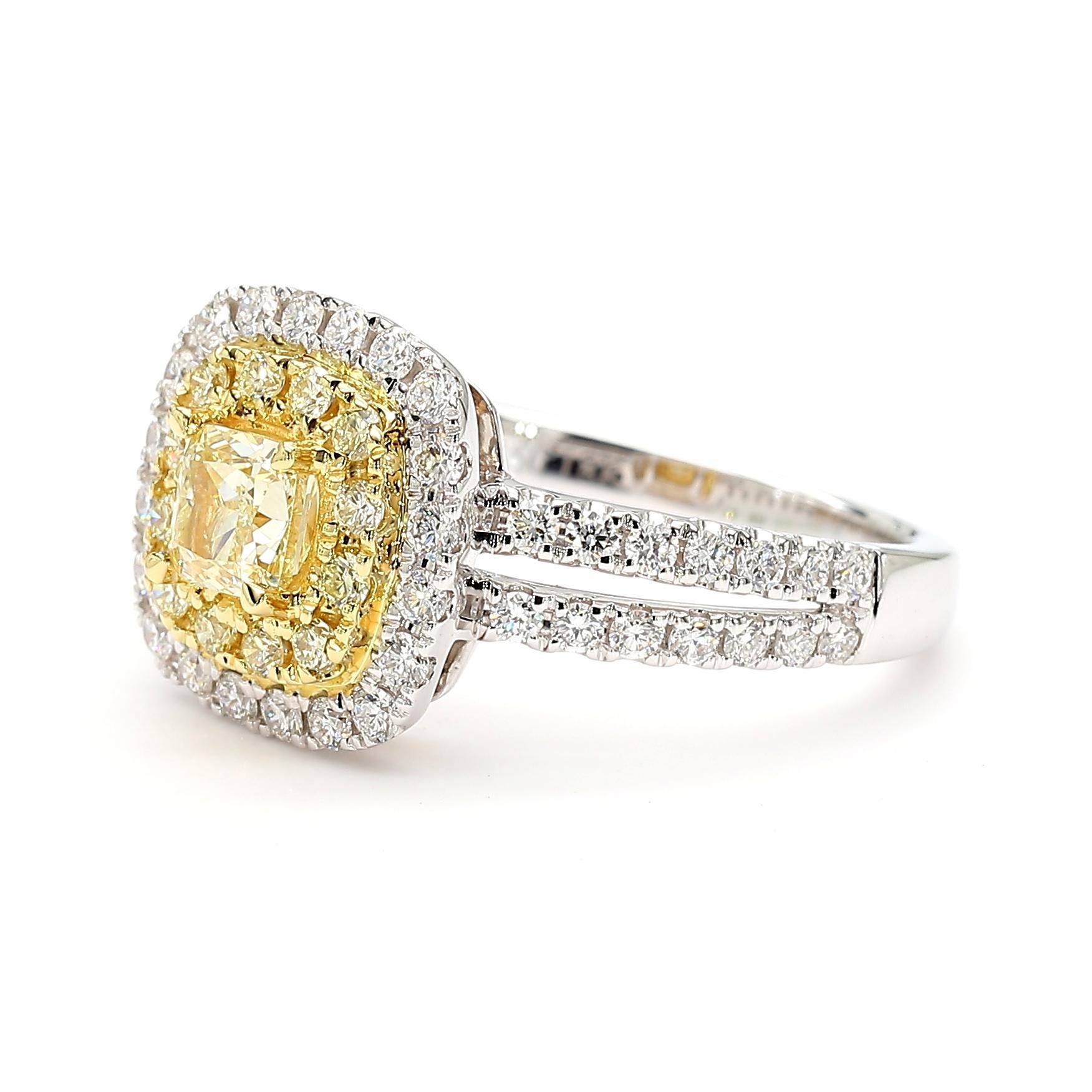 RareGemWorld's beautiful diamond ring. Mounted in a beautiful Platinum setting with a natural cushion cut yellow diamond. The yellow diamond is surrounded by round natural yellow diamond melee and round natural white diamond melee. This ring is