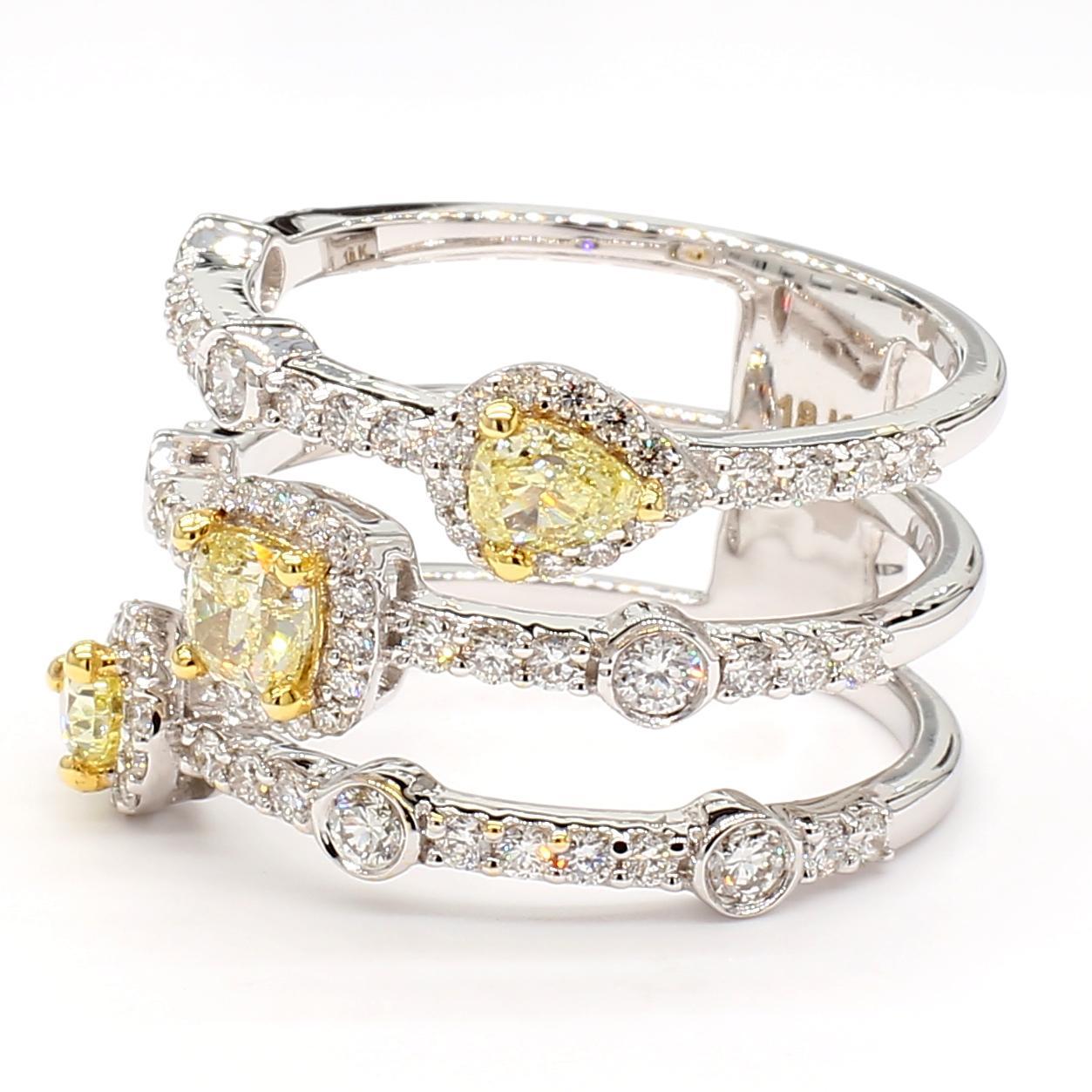 RareGemWorld's intriguing diamond ring. Mounted in a beautiful 18K Yellow and White Gold setting with a natural cushion-cut yellow diamond and two natural pear-cut yellow diamonds. The yellow diamond is surrounded by round natural white diamond