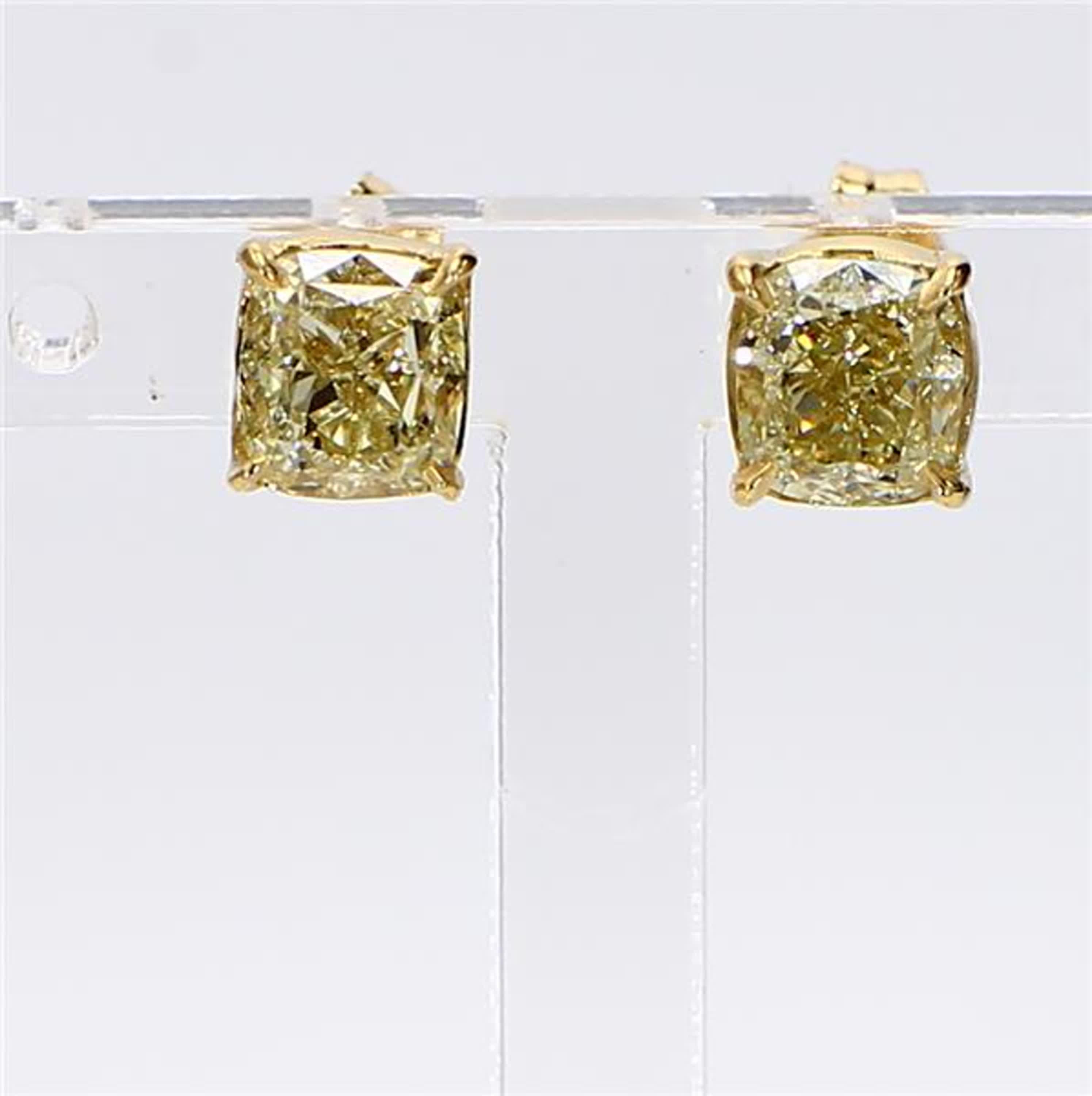 RareGemWorld's classic diamond earrings. Mounted in a beautiful 18K Yellow Gold setting with natural cushion cut yellow diamonds. These earrings are guaranteed to impress and enhance your personal collection!

Total Weight: 1.81cts

Diamond