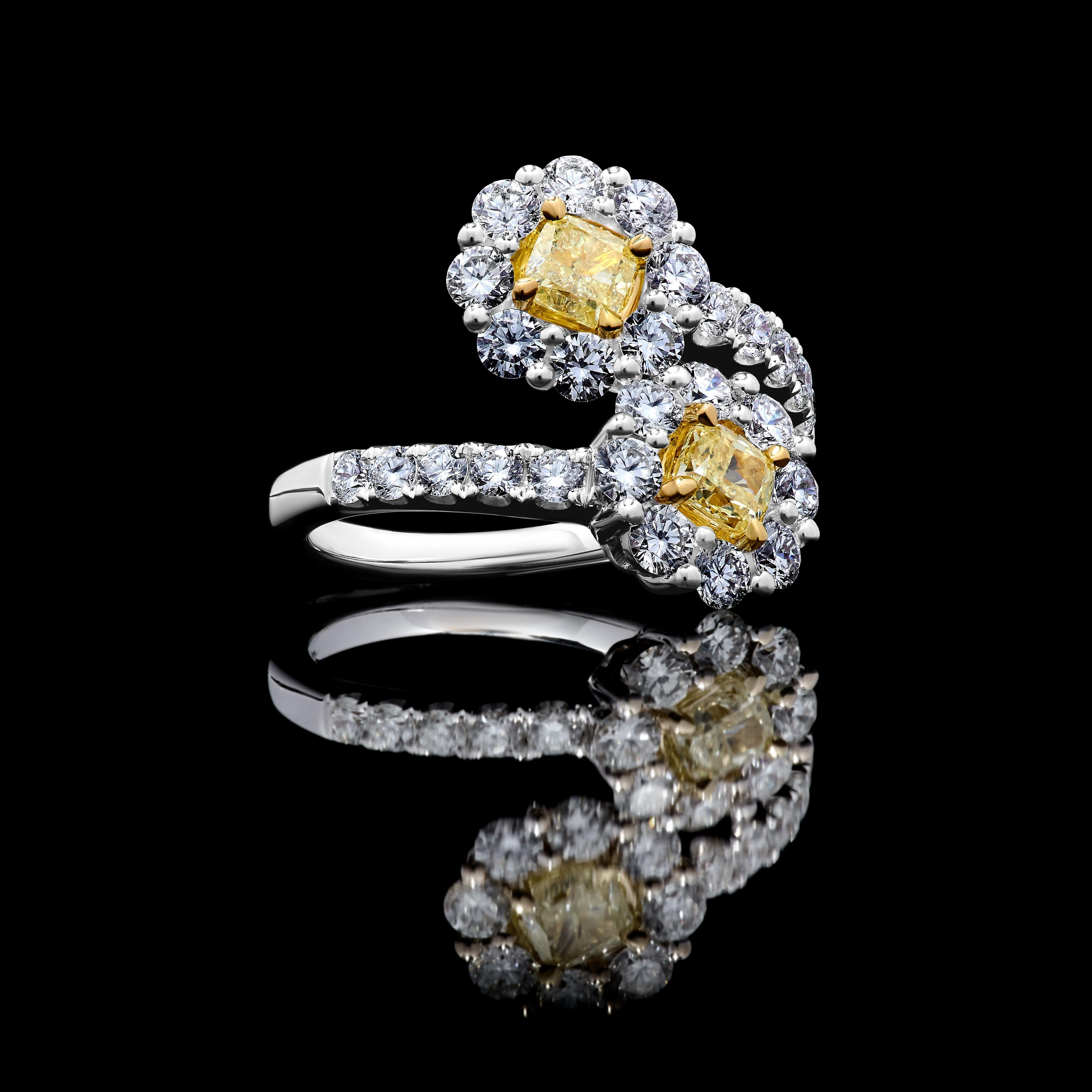 RareGemWorld's classic GIA certified diamond ring. Mounted in a beautiful 18K Yellow and White setting with two natural cushion cut yellow diamonds. The yellow diamonds are surrounded by round natural white diamond melee. This ring is guaranteed to