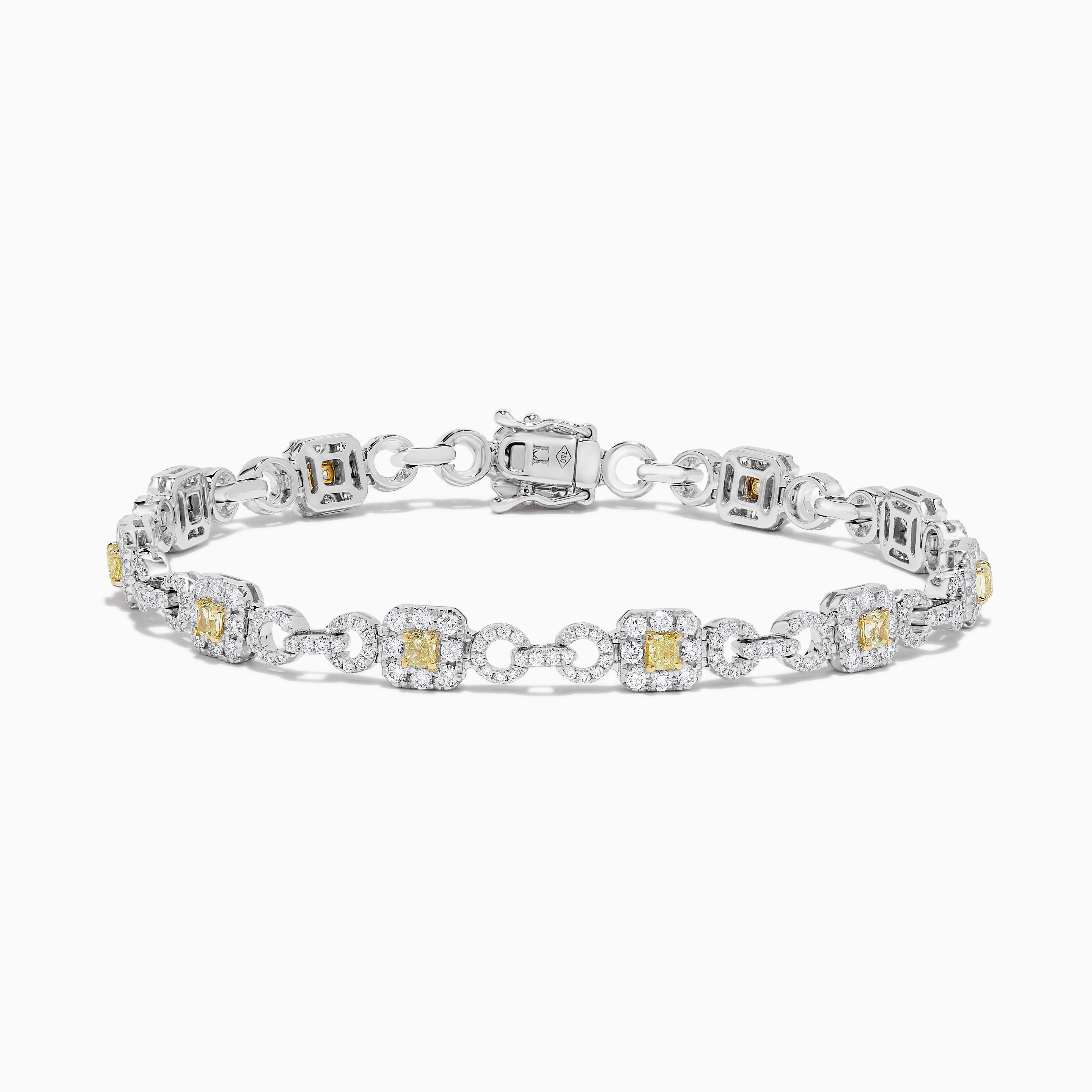 RareGemWorld's classic diamond bracelet. Mounted in a beautiful 18K Yellow and White Gold setting with natural cushion cut yellow diamonds. The yellow diamonds are surrounded by small round natural white diamond melee. This bracelet is guaranteed to