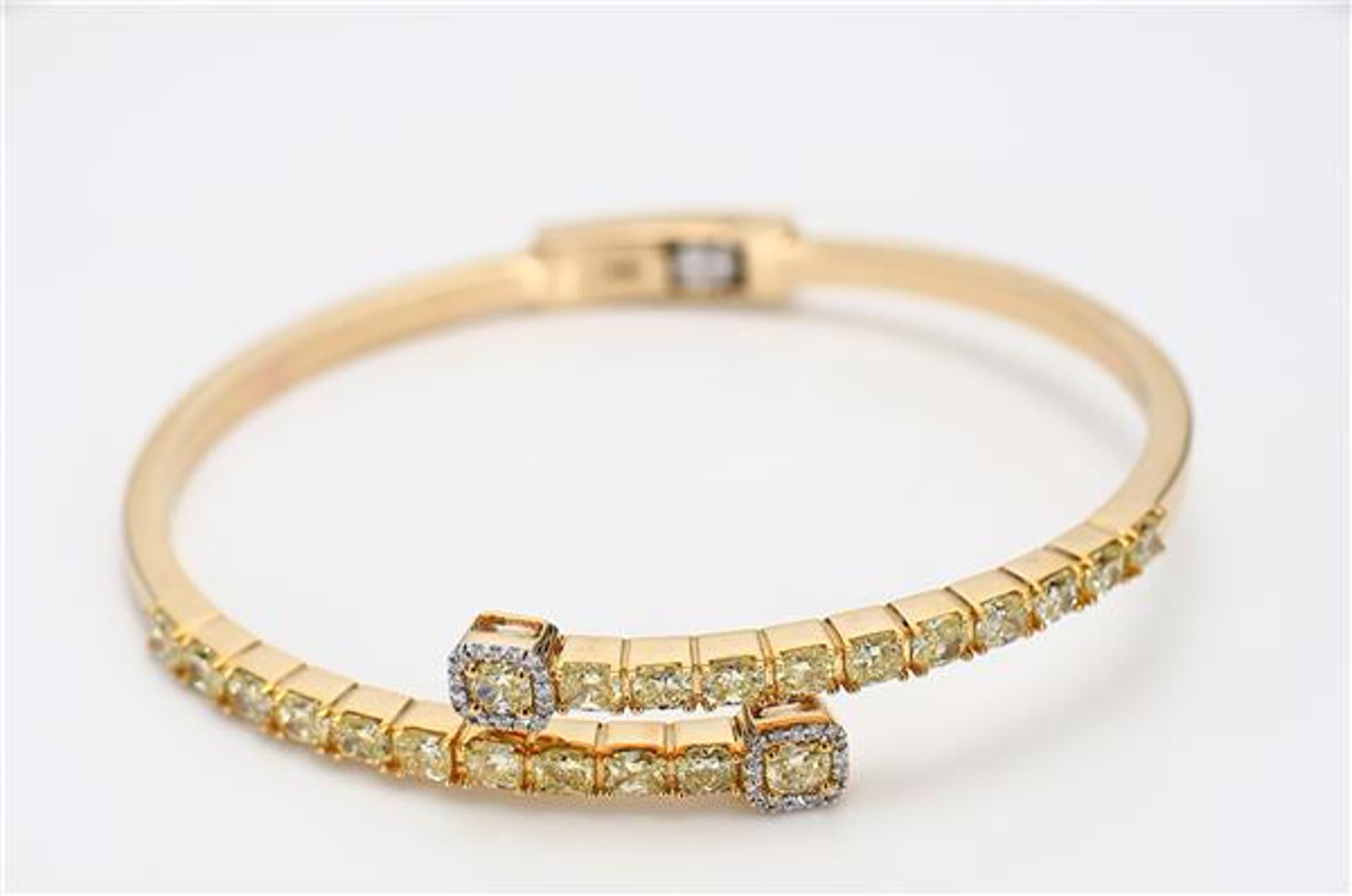 RareGemWorld's classic diamond bracelet. Mounted in a beautiful 18K Yellow Gold setting with natural cushion cut yellow diamonds. The yellow diamonds are surrounded by small round natural white diamond melee. This bracelet is guaranteed to impress!