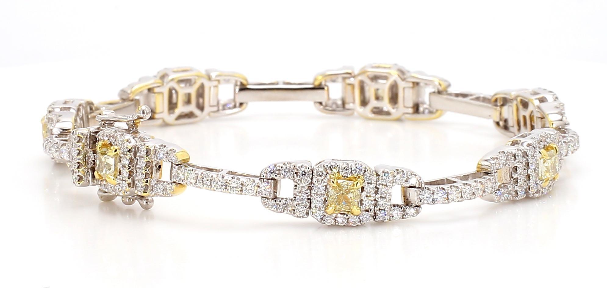 RareGemWorld's beautiful diamond bracelet. Mounted in a beautiful 18K Yellow and White Gold setting with natural cushion cut yellow diamonds. The yellow diamonds are surrounded by small round natural white diamond melee. This bracelet is guaranteed