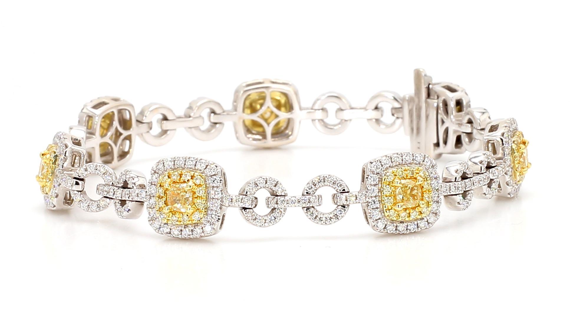 RareGemWorld's beautiful diamond bracelet. Mounted in a beautiful 18K Yellow and White Gold setting with natural cushion cut yellow diamonds. The yellow diamonds are surrounded by small round natural white diamond melee and round natural yellow