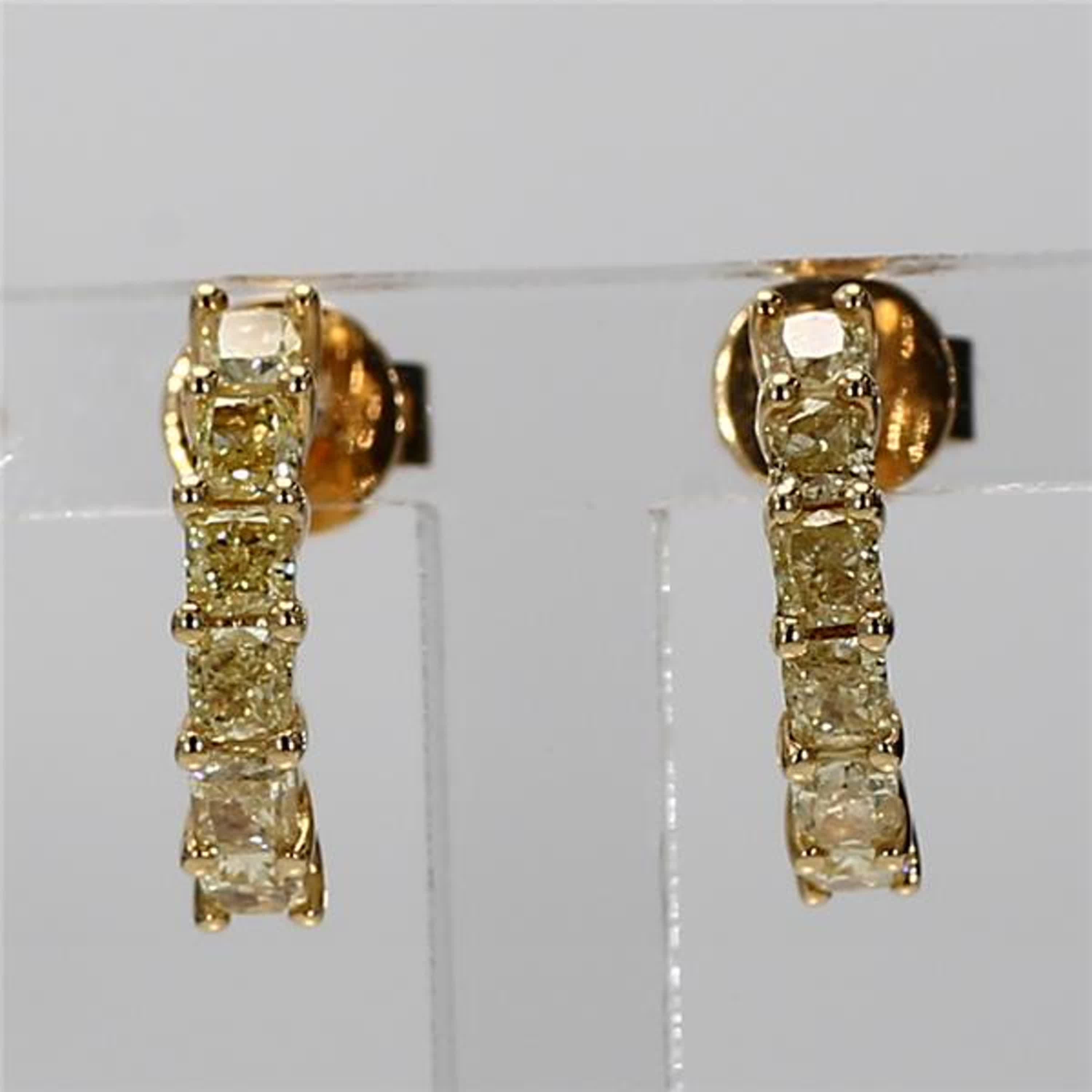 RareGemWorld's classic diamond earrings. Mounted in a beautiful 18K Yellow Gold setting with natural cushion cut yellow diamonds. These earrings are guaranteed to impress and enhance your personal collection!

Total Weight: .82cts

Center Diamond