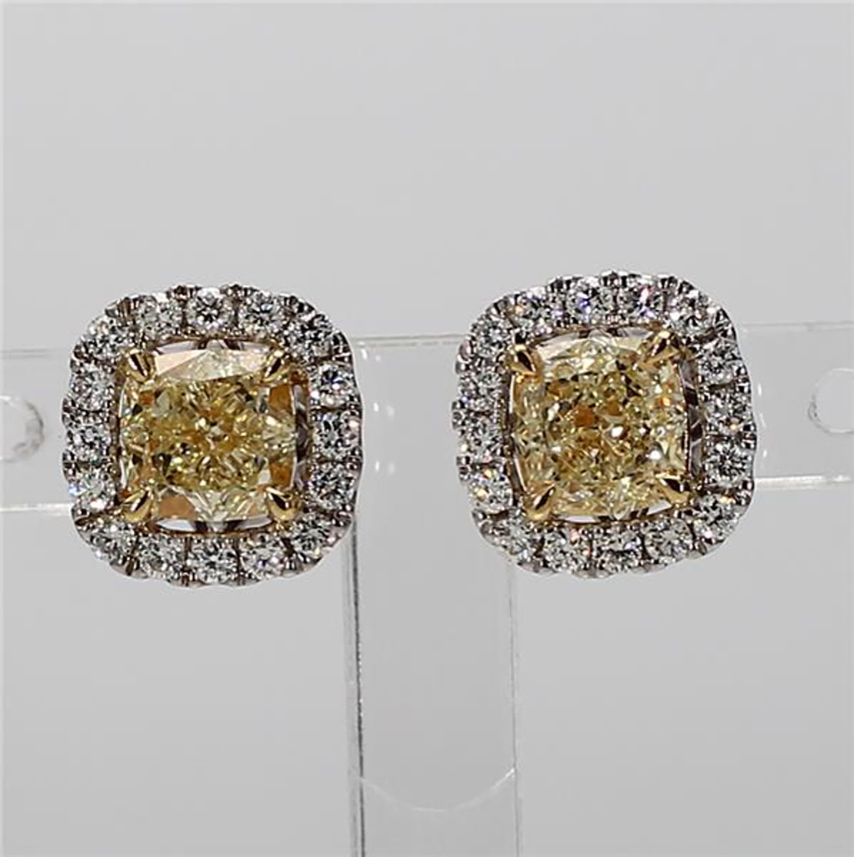 RareGemWorld's classic natural cushion cut yellow diamond earrings. Mounted in a beautiful 18K Yellow and White Gold setting with natural cushion cut yellow diamonds. The yellow diamonds are surrounded by small round natural white diamond melee.