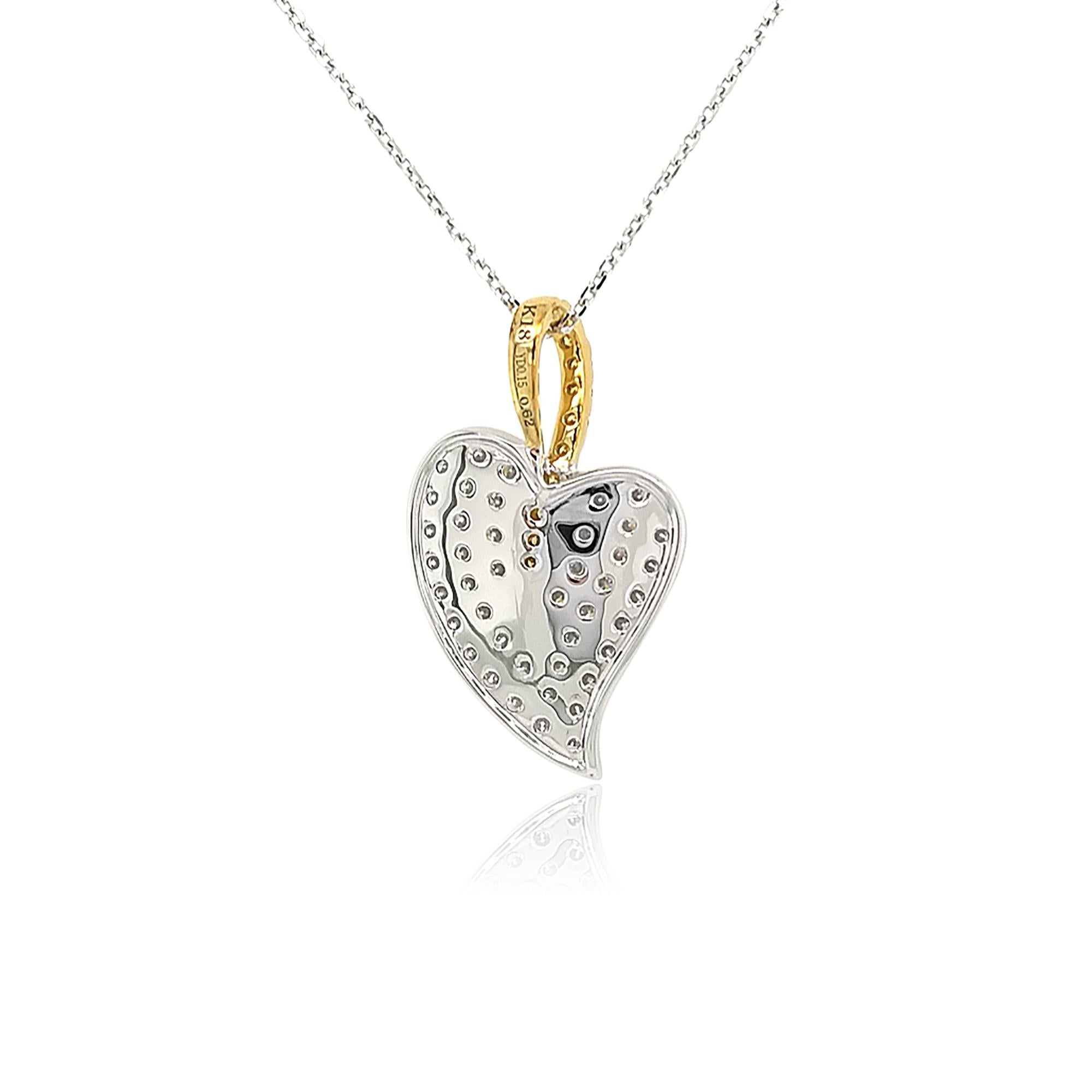 This alluring pendant features a section of pavé set natural Yellow Diamonds and White Diamonds, set in 18K White and Yellow Gold. A contemporary twist on a classic combination, this pendant will add a sumptuous pop of colour to even the simplest of