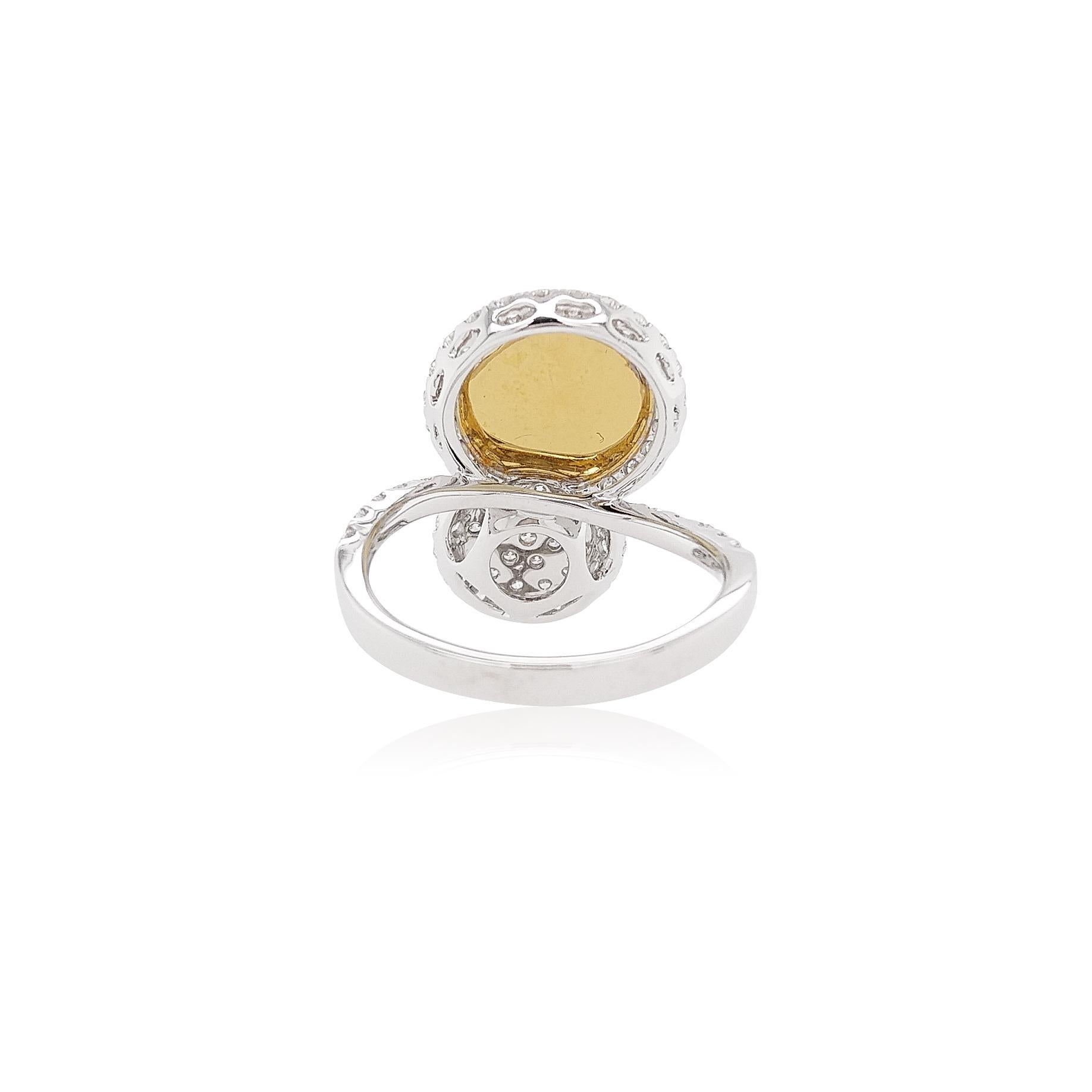 This exquisite platinum ring features lustrous crisp natural Yellow Diamonds perfectly offset by the delicate white diamonds which surround them, alongside scintillating White Diamonds. A perfect statement piece, this ring will add a touch of
