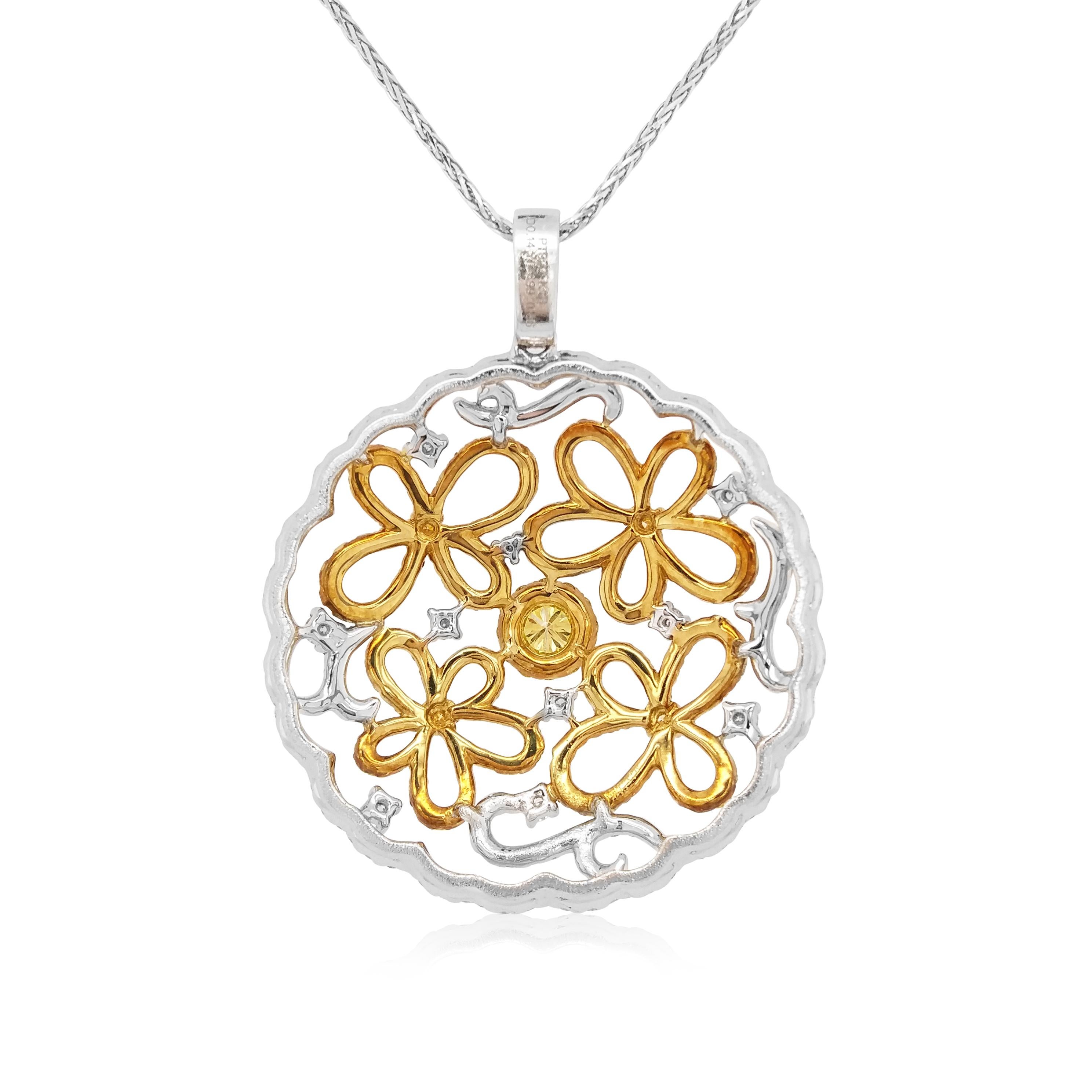 This elegant pendant features a lustrous round shape Yellow Diamond with a scintillating Yellow and White diamonds arrangement. Set in Platinum and 18 Karat Yellow Gold this elegant pendant is contemporary, yet timeless. Perfect to take you from day