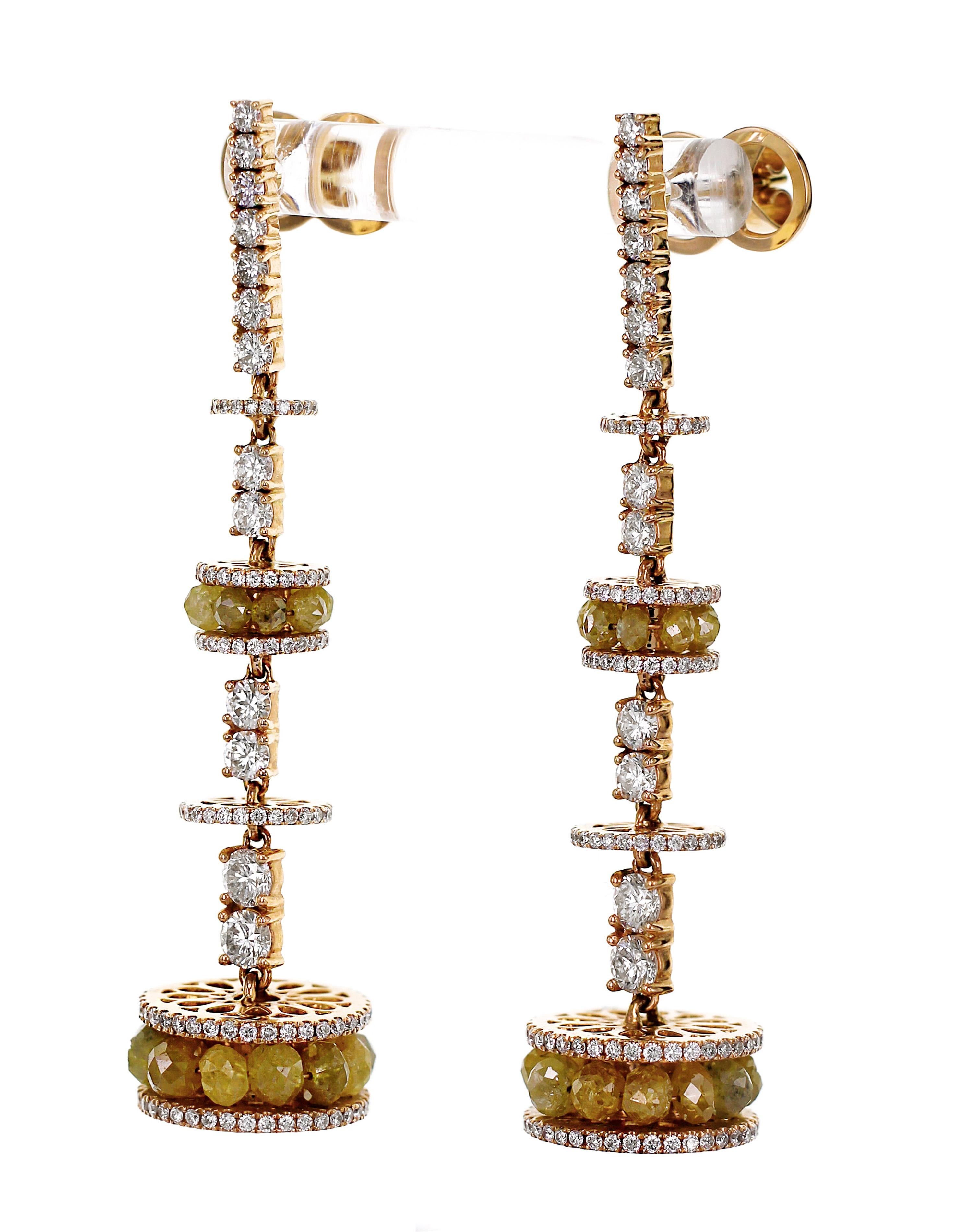 7.61 Carats of Natural Yellow color diamond beads and 2.67 carat of F color VS clarity diamonds are set together in this Chandelier earring. The earring has a lovely fall and is a perfect earring for a cocktail event.