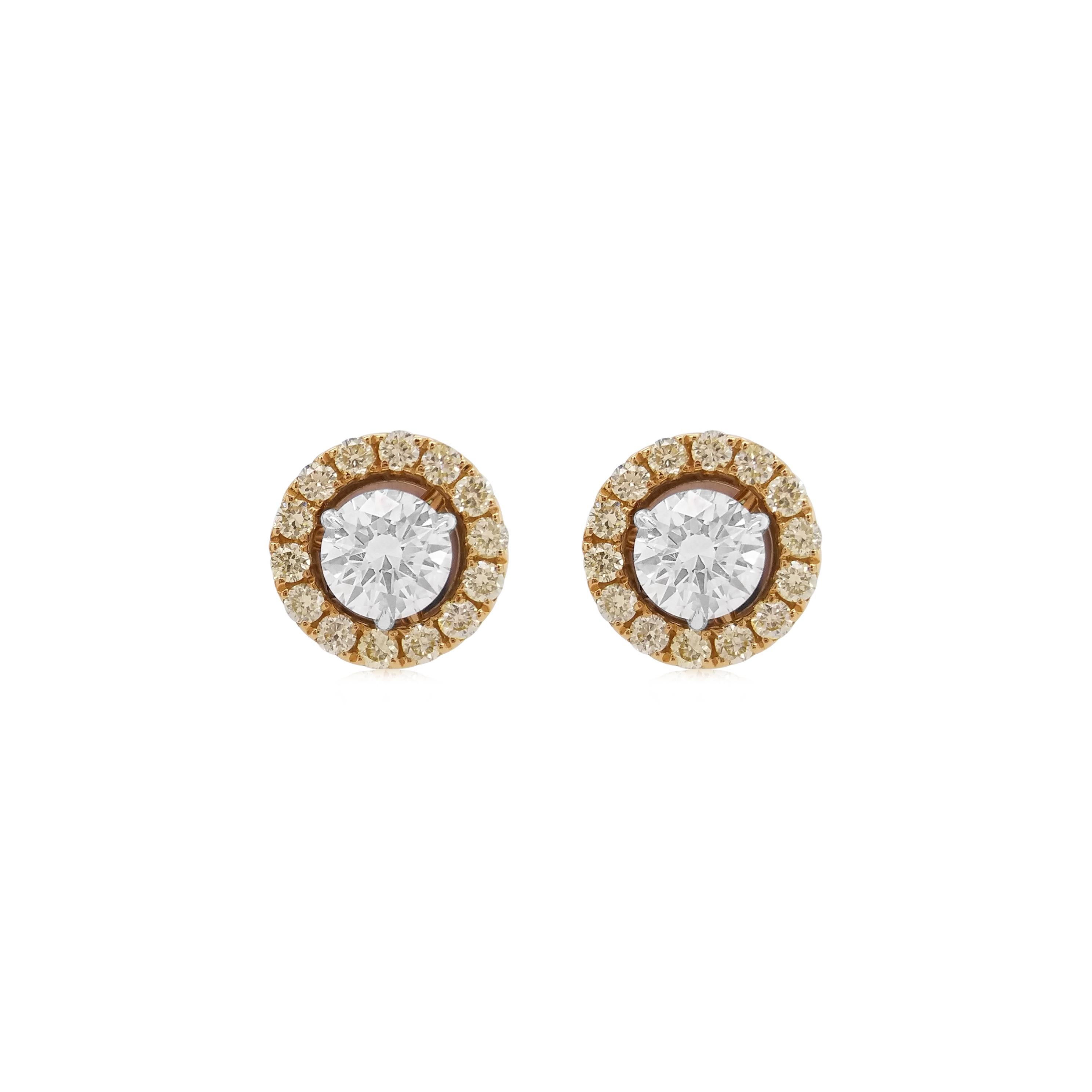 Beautiful stud earrings with GIA-certified Natural white diamonds with a halo of Natural Fancy Yellow diamonds.

Center White diamond - 0.6 cts (GIA Certified)
Round Yellow Diamonds - 0.3 cts
18k Gold

HYT Jewelry is a privately owned company