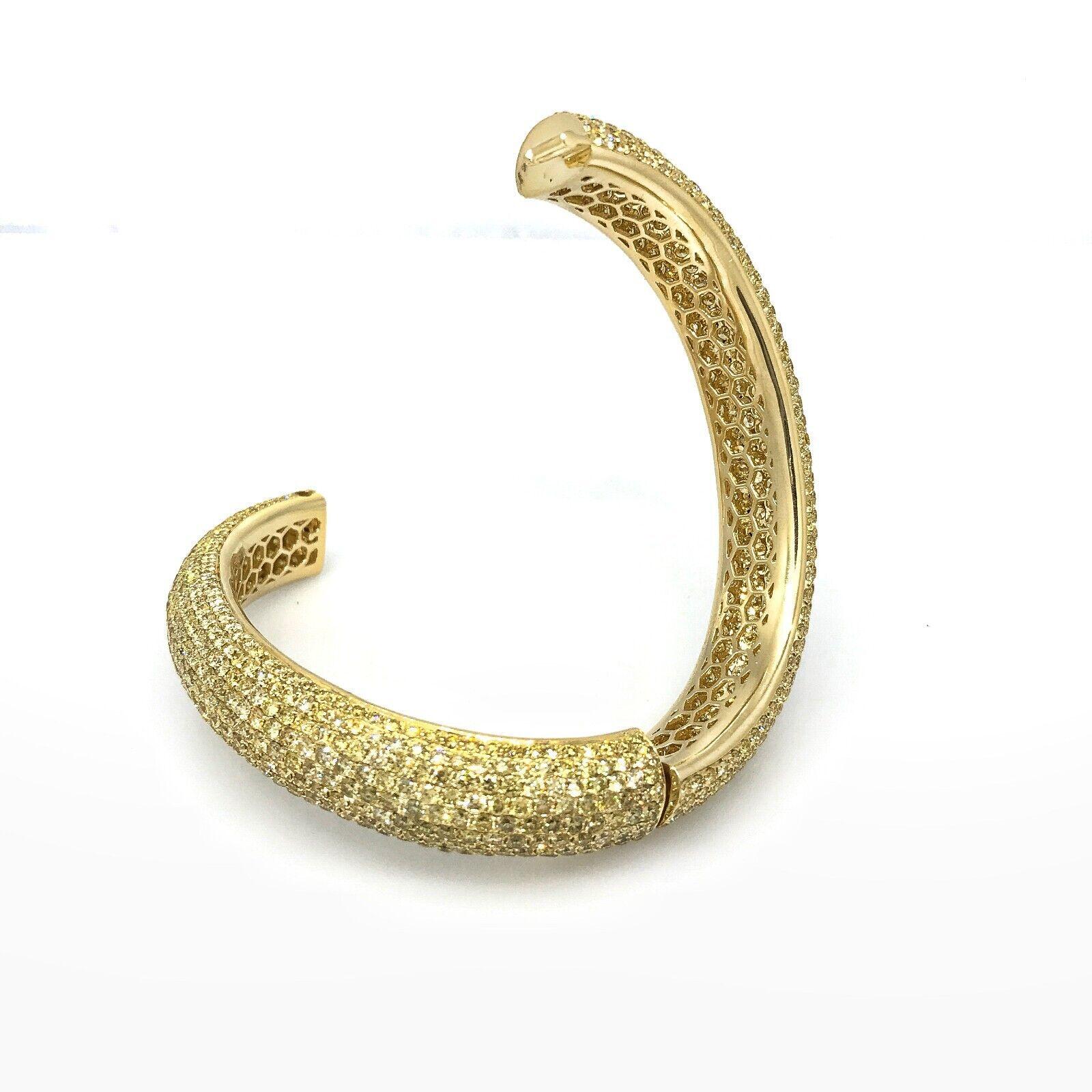 Natural Yellow Diamond Bangle Bracelet with 24.36 Carats in 18k Yellow Gold

Pave Diamond Bracelet features 24.36 carats of Natural Yellow Round Brilliant Diamonds set in 9 rows all the way around the bracelet set in 18k Yellow Gold. Bracelet is