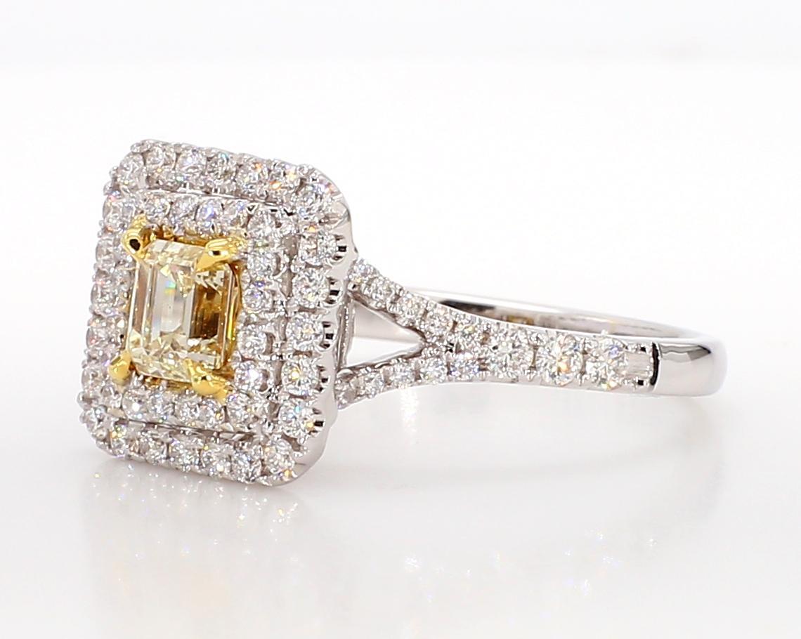 RareGemWorld's beautiful diamond ring. Mounted in a beautiful 18K Yellow and White Gold setting with a natural emerald cut yellow diamond. The yellow diamond is surrounded by round natural white diamond melee. This ring is guaranteed to impress and