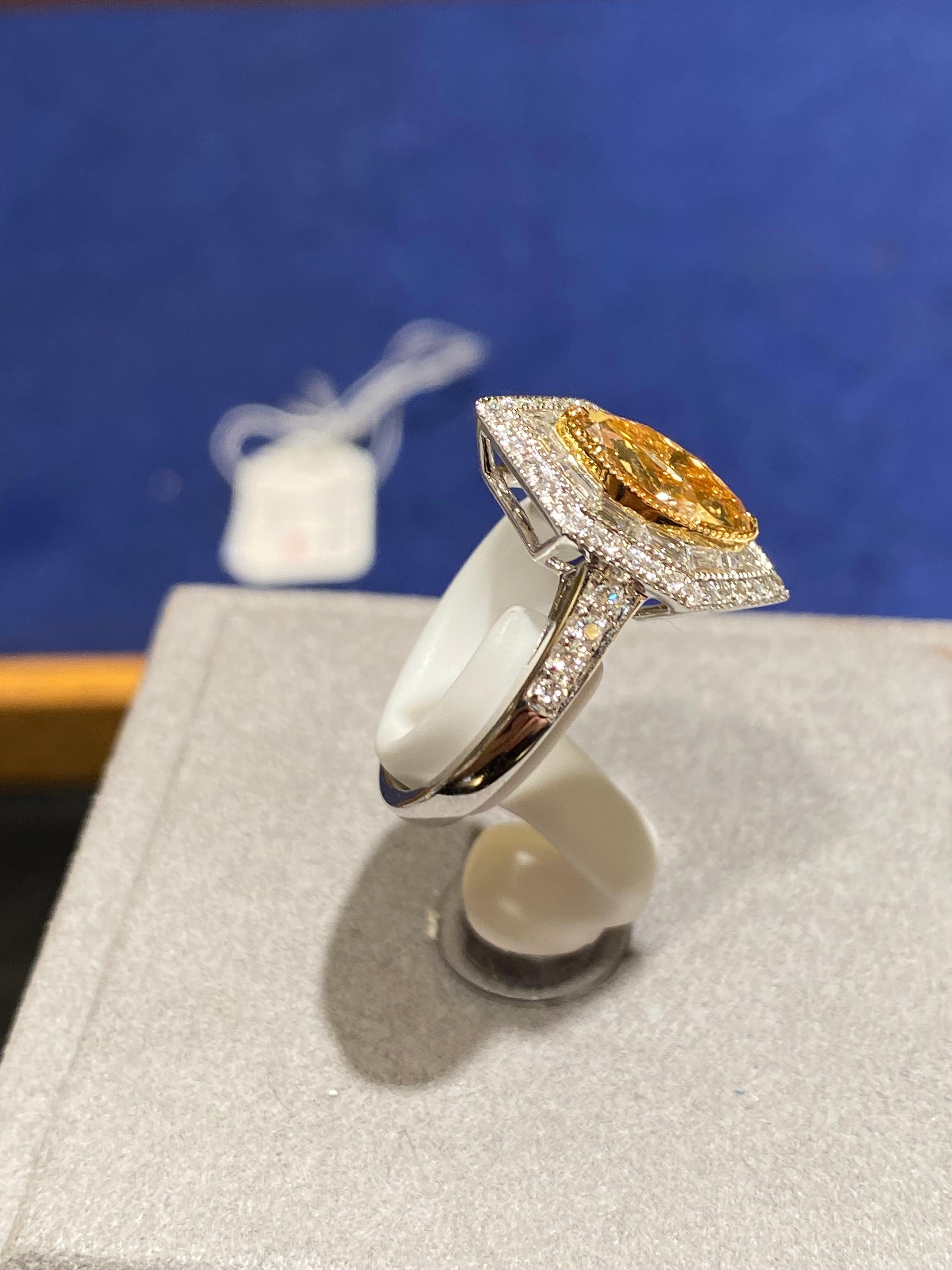18k gold
Main center diamond is 1.3 CT intensive brownish yellow Si clarity
Natural diamonds 0.862 ct in vs clarity and E/F colour
Ring is set in 18k white and yellow gold 
total weight is 5.54 gram
