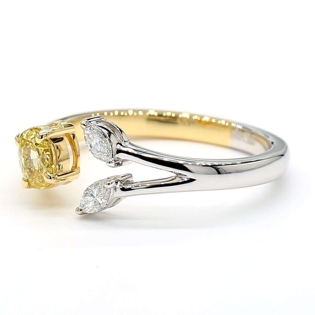 RareGemWorld's beautiful diamond ring. Mounted in a beautiful 18K Yellow and White Gold setting with a natural oval cut yellow diamond complimented with natural marquise cut white diamonds. This ring is guaranteed to impress and enhance your