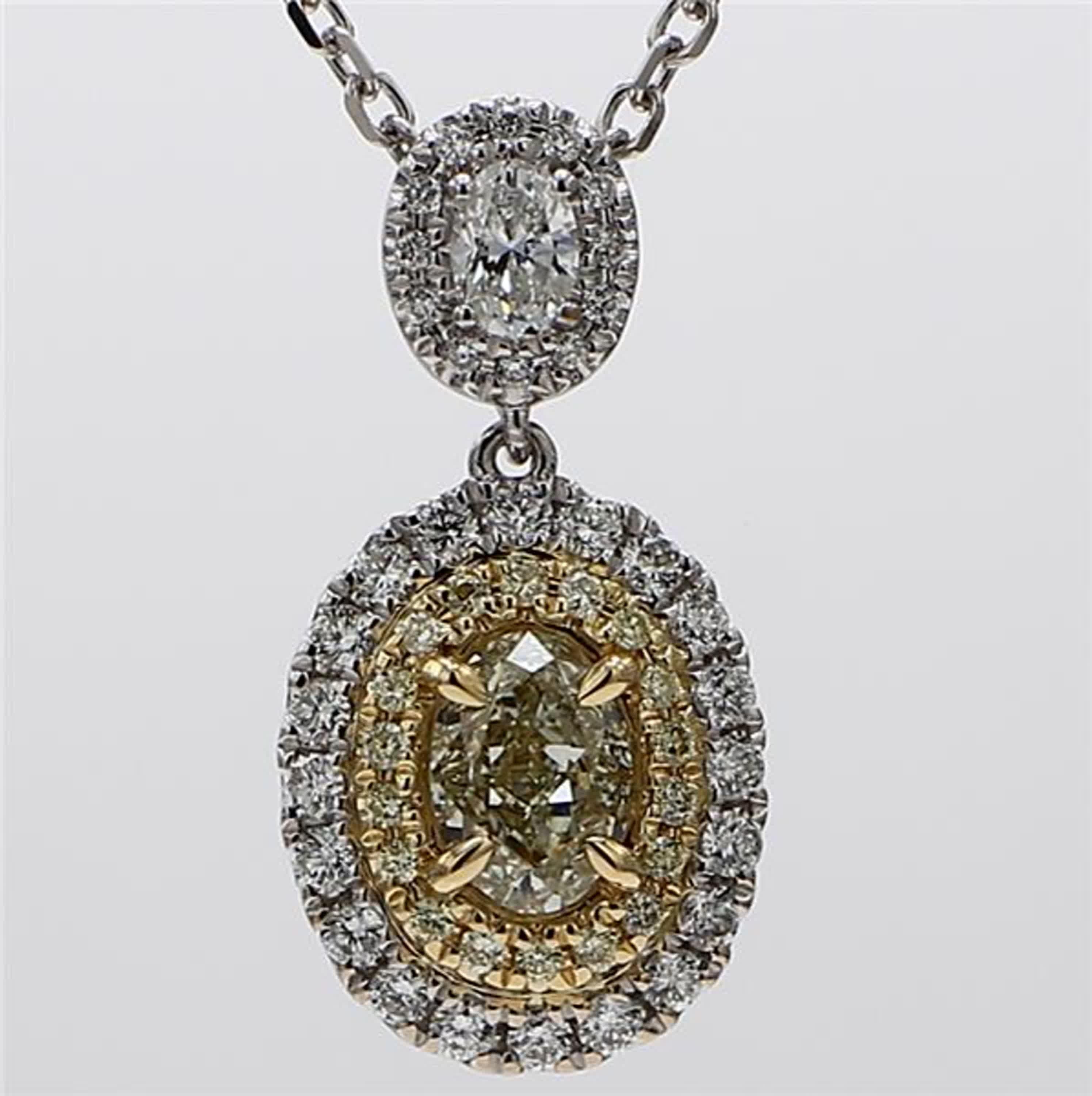 RareGemWorld's classic diamond pendant. Mounted in a beautiful 18K Yellow and White Gold setting with a natural oval cut yellow diamond complimented by natural oval cut white diamond. These diamonds are surrounded by natural round yellow diamond