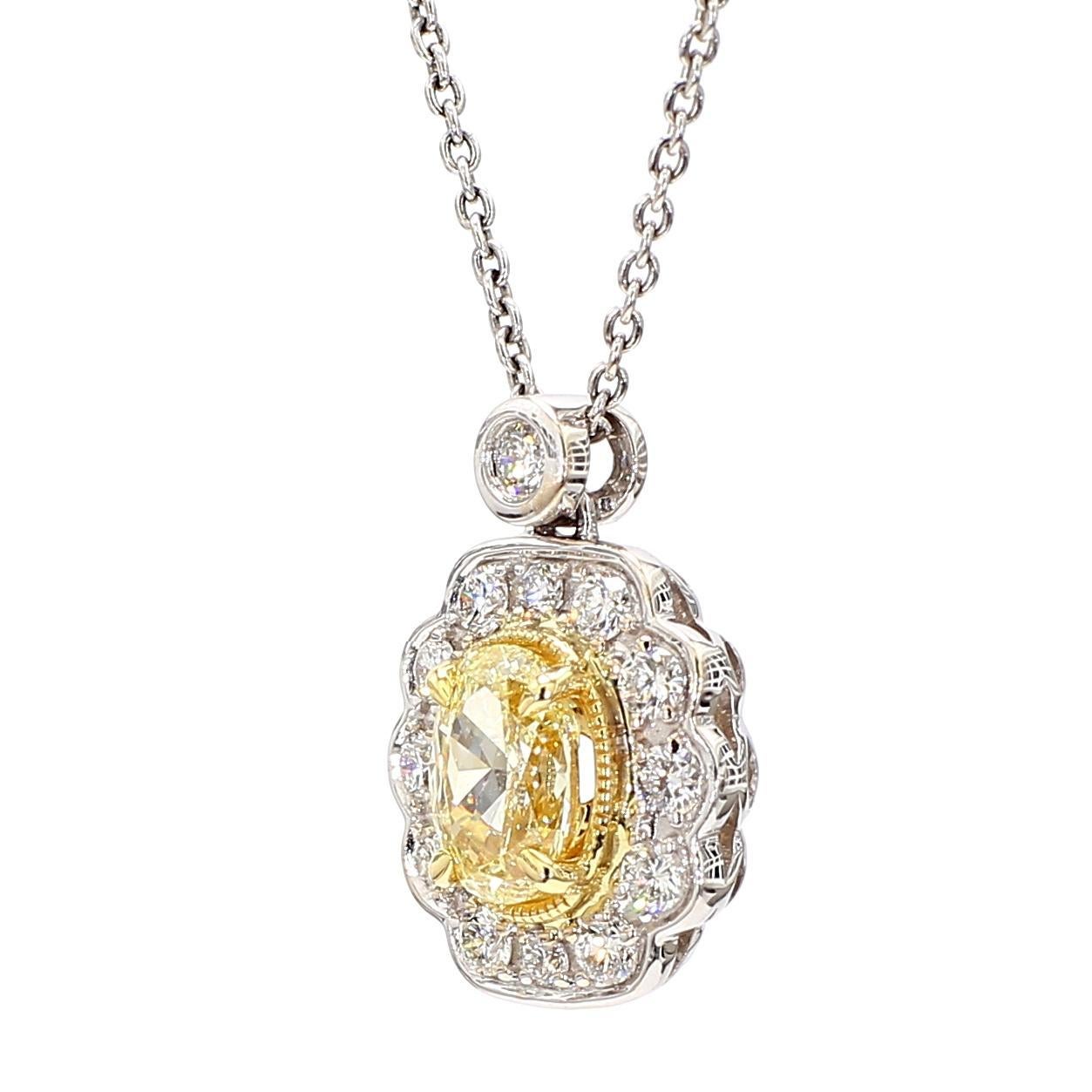 RareGemWorld's beautiful diamond pendant. Mounted in a beautiful 18K Yellow and White Gold setting with a natural oval cut yellow diamond. The yellow diamond is surrounded by natural round white diamond melee. This pendant is guaranteed to impress