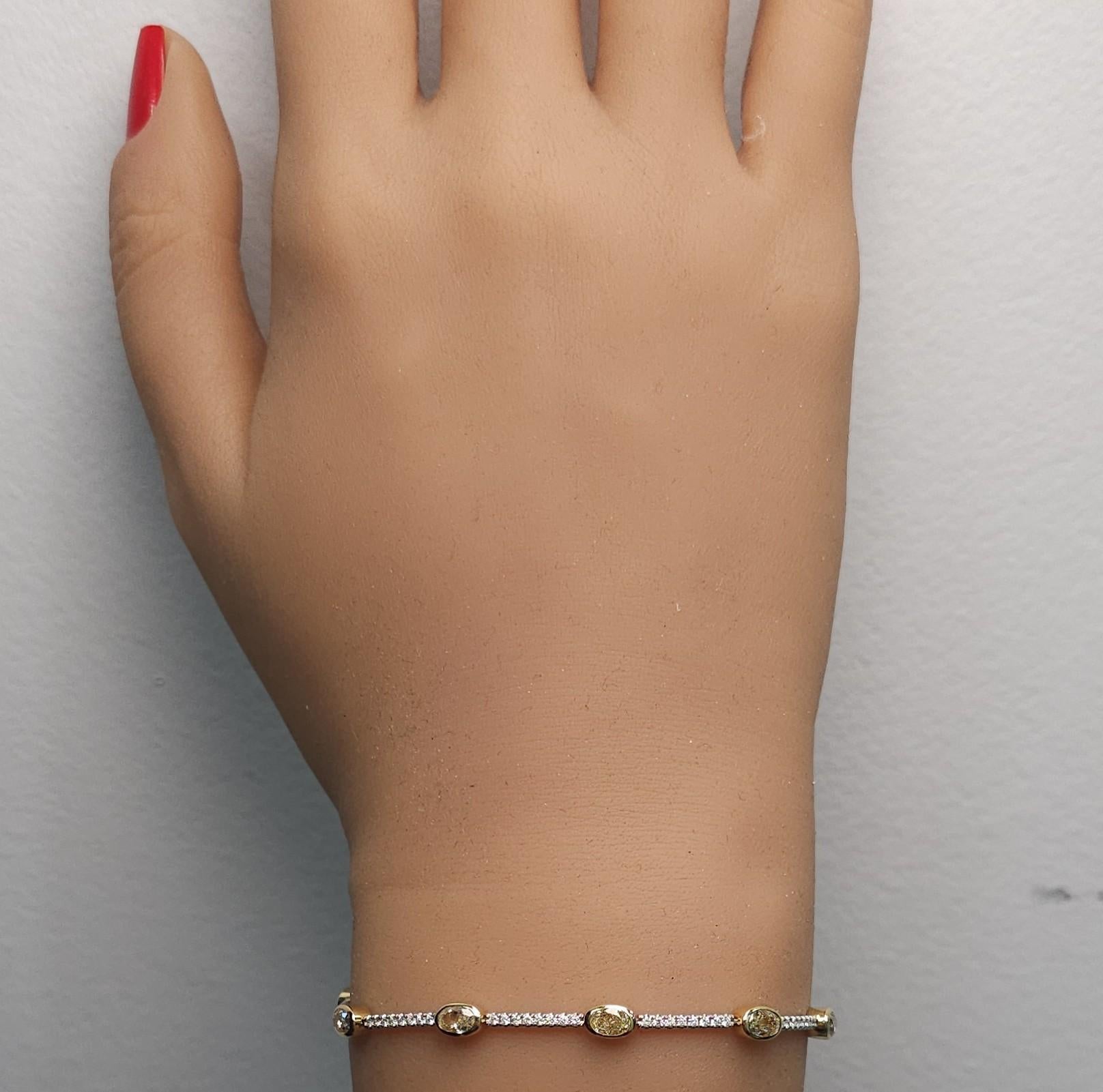 Natural Yellow Oval Diamond 3.68 Carat TW Gold Tennis Bracelet In New Condition For Sale In New York, NY