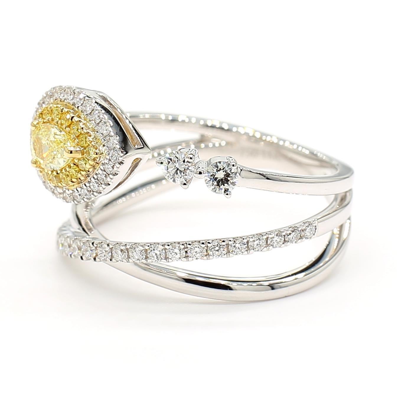RareGemWorld's beautiful diamond ring. Mounted in a beautiful 18K Yellow and White setting with a natural pear cut yellow diamond surrounded by round natural white diamond melee and round natural yellow diamond melee. This ring is guaranteed to