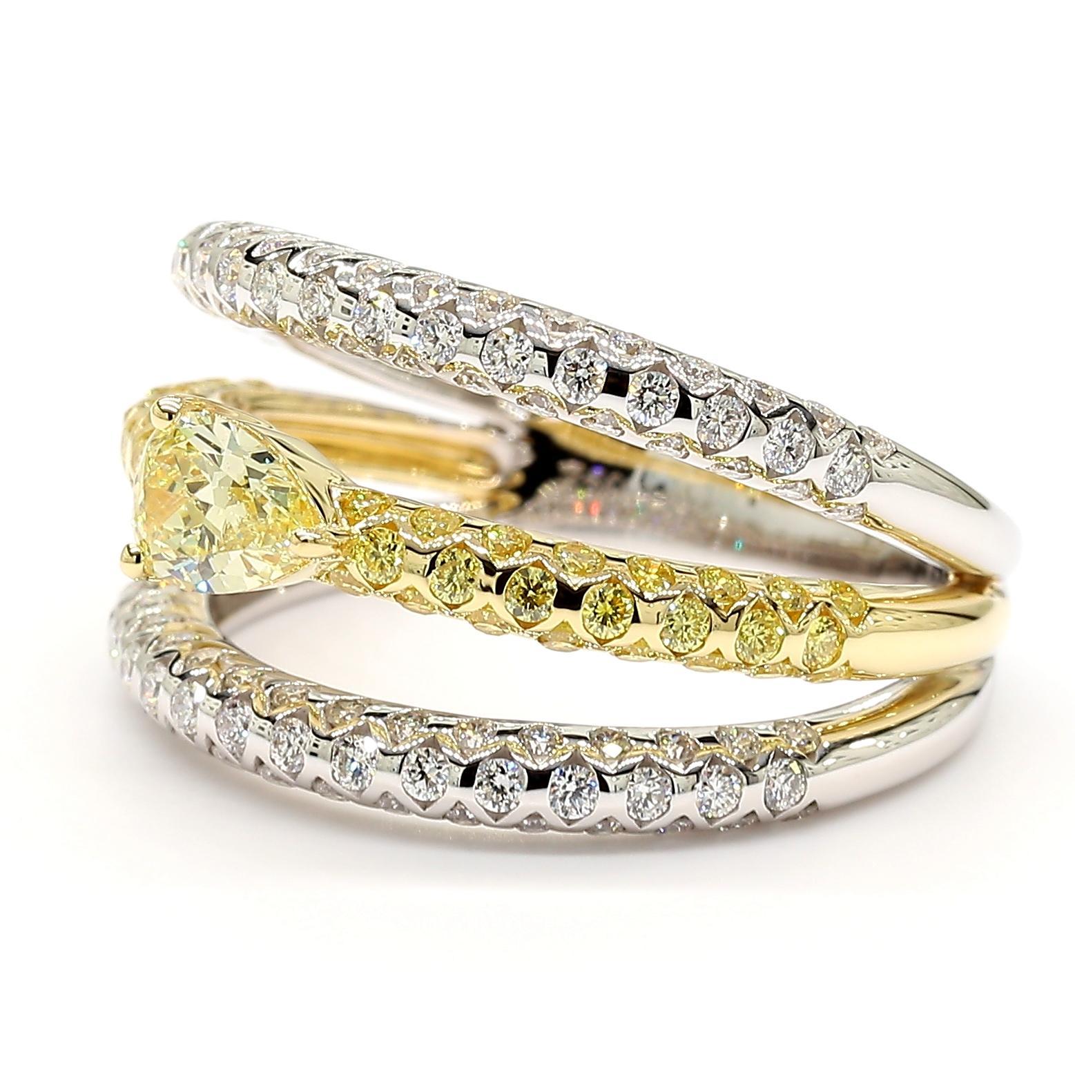RareGemWorld's beautiful diamond ring. Mounted in a beautiful 18K Yellow and White setting with a natural pear cut yellow diamond surrounded by round natural white diamond melee and round natural yellow diamond melee. This ring is guaranteed to