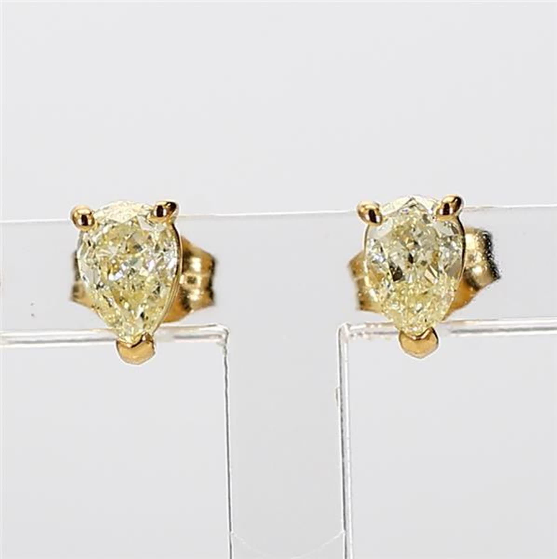RareGemWorld's classic natural pear cut yellow diamond earrings. Mounted in a beautiful 18K Yellow Gold setting with natural pear cut yellow diamonds. These earrings are guaranteed to impress and enhance your personal collection!

Total Weight: