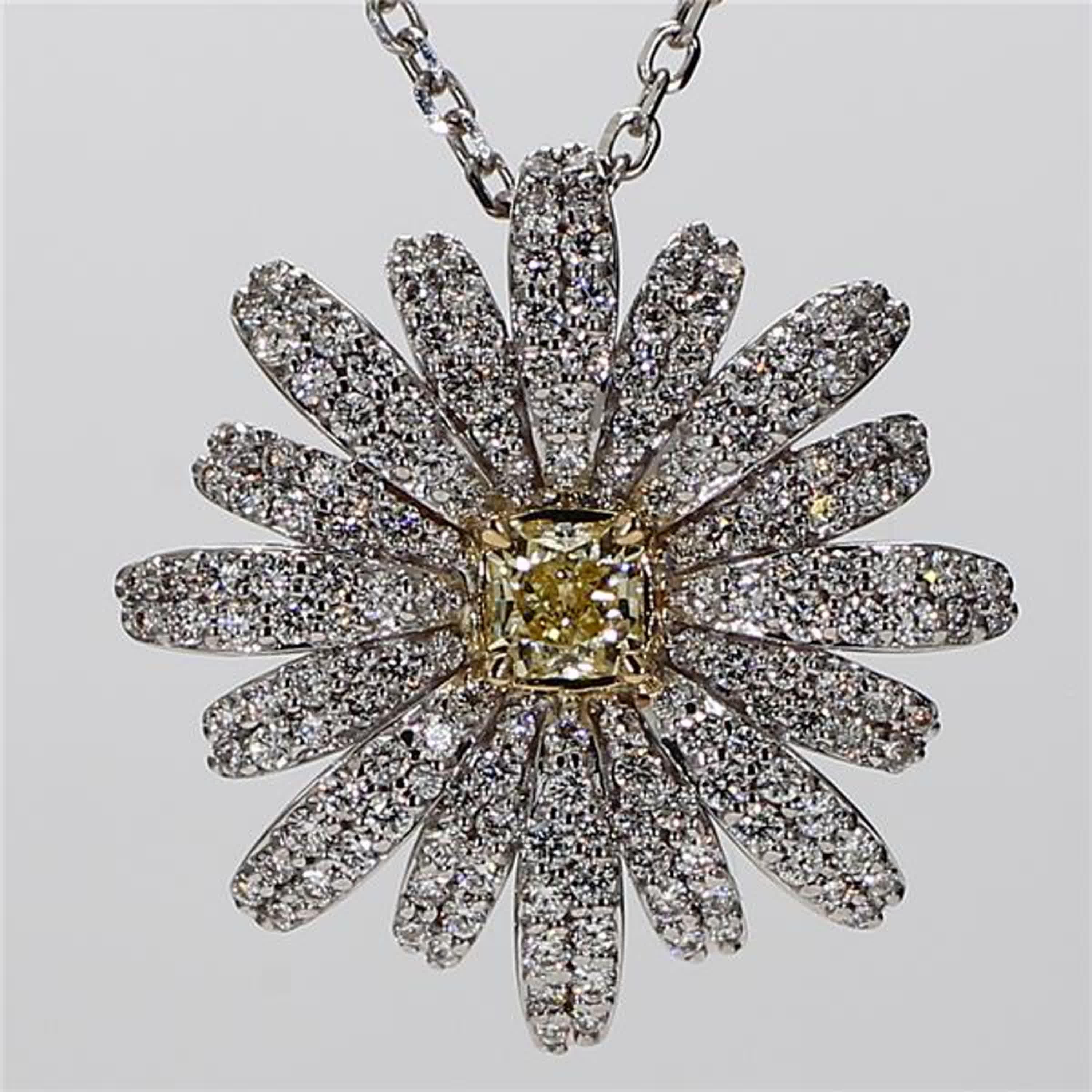 RareGemWorld's classic diamond necklace. Mounted in a beautiful 18K Yellow and White Gold setting with a natural radiant cut yellow diamond. The yellow diamond is surrounded by round natural white diamond melee in a beautiful flower shape. This