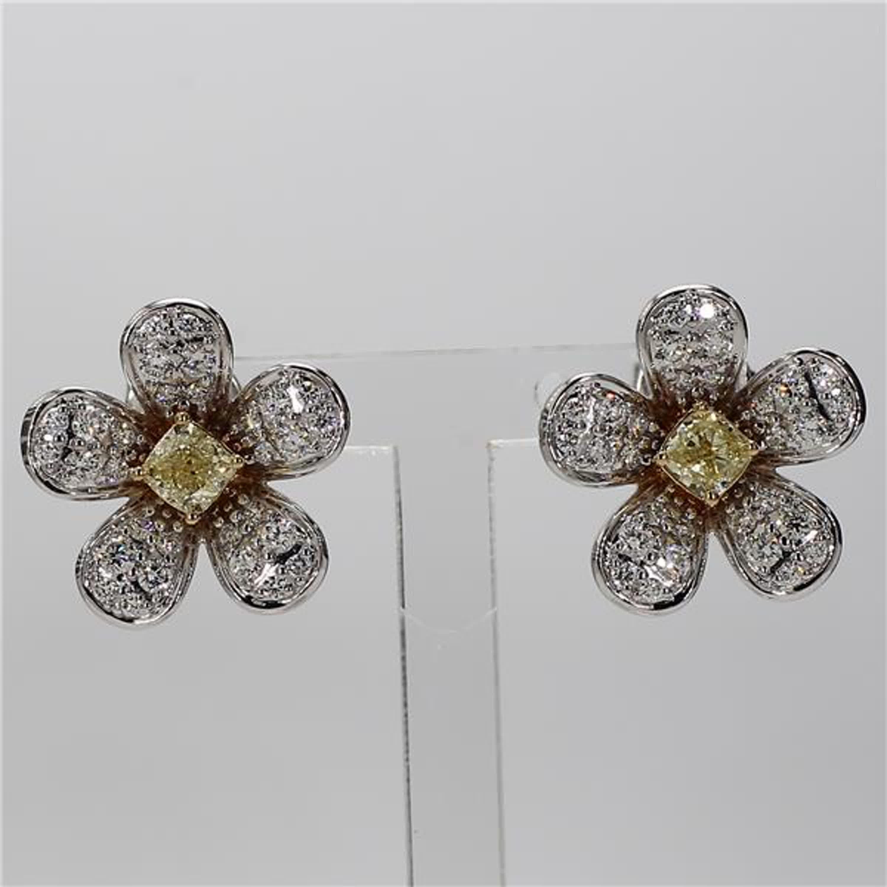 RareGemWorld's classic diamond earrings. Mounted in a beautiful 18K Yellow and White Gold setting with natural radiant cut yellow diamonds. The yellow diamonds are surrounded by small round natural white diamond melee in a beautiful flower shape.