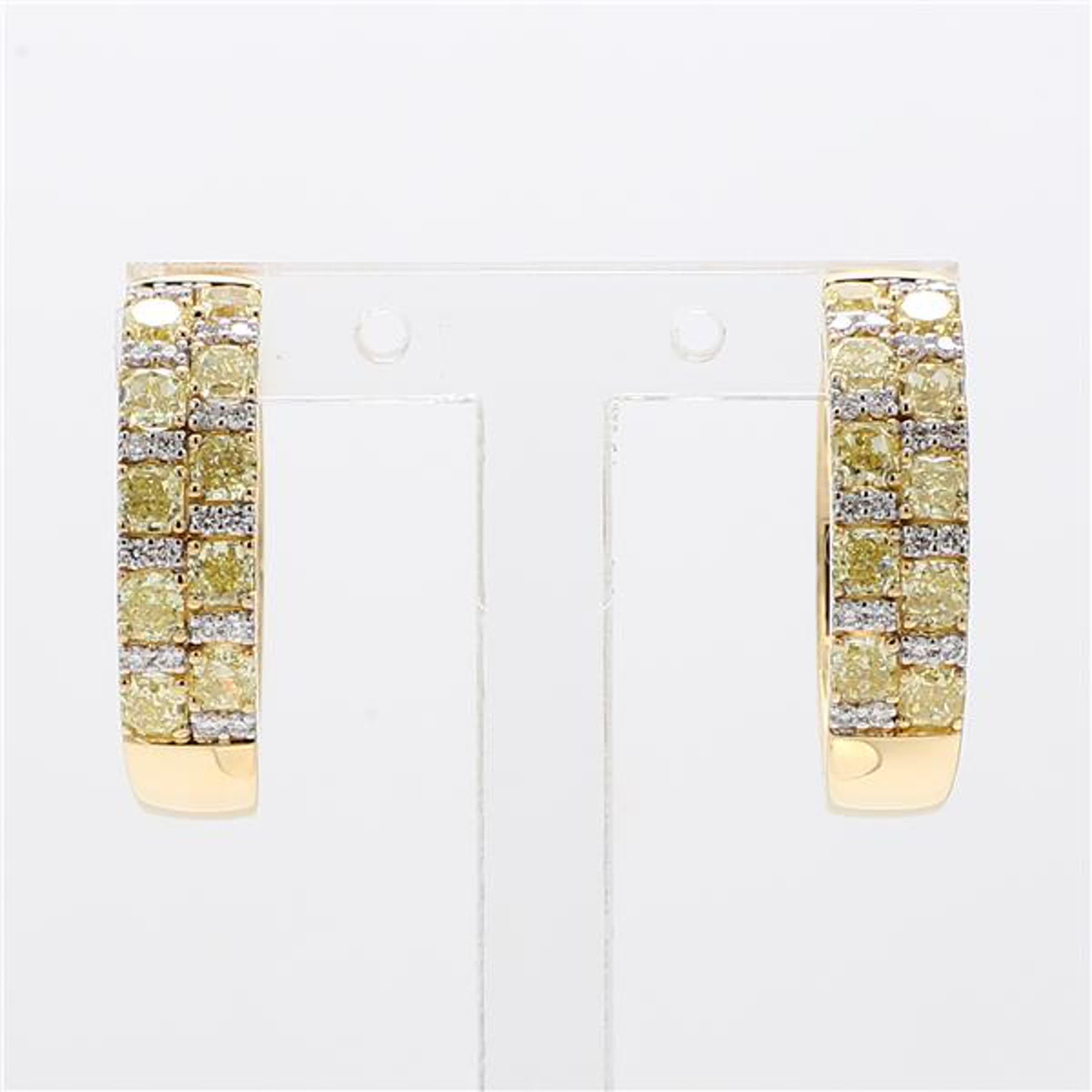 RareGemWorld's classic diamond earrings. Mounted in a beautiful 18K Yellow Gold setting with natural radiant cut yellow diamonds complimented by round natural white diamond melee. These earrings are guaranteed to impress and enhance your personal