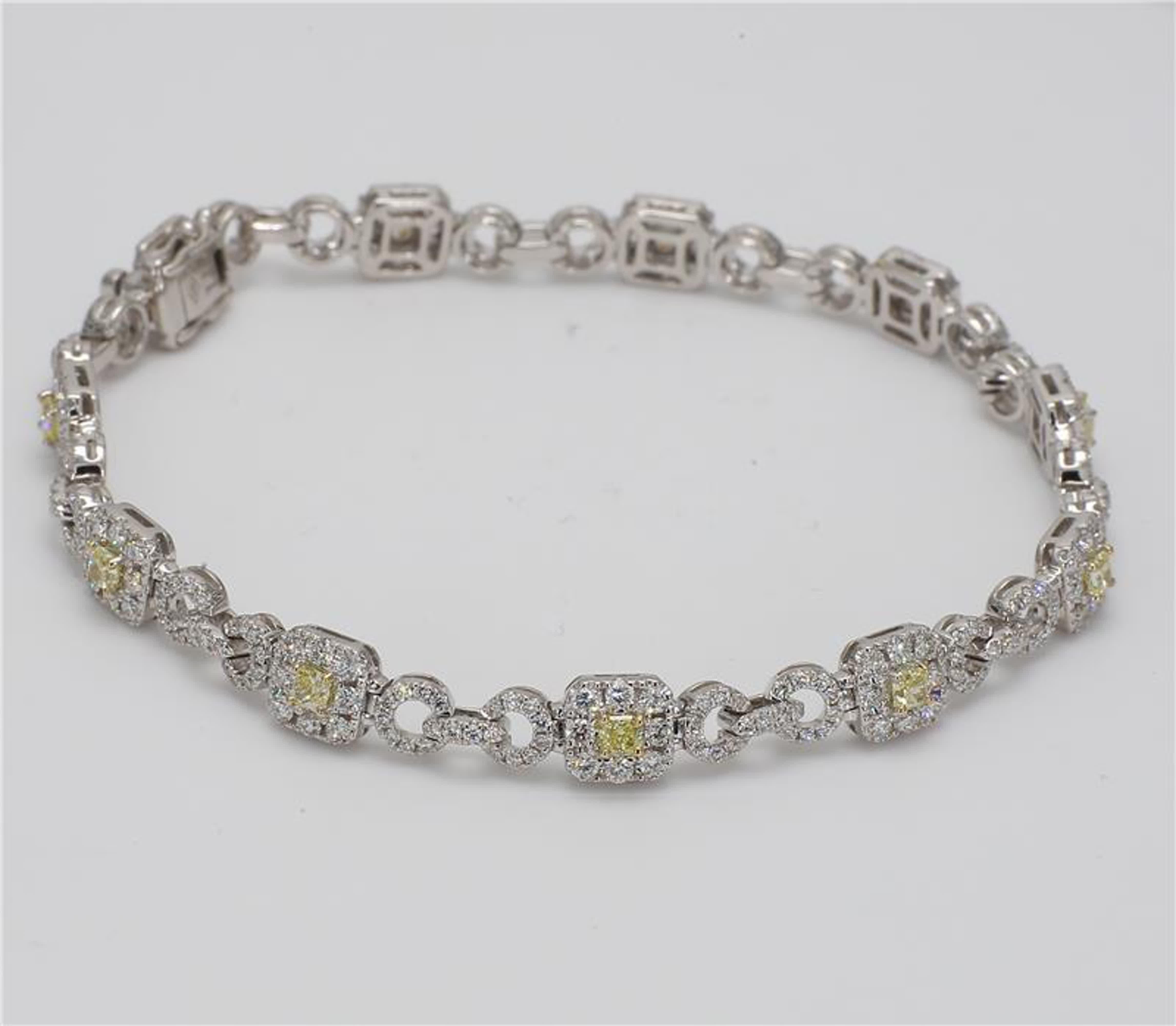 RareGemWorld's classic natural radiant cut yellow diamond bracelet. Mounted in a beautiful 18K Yellow and White Gold setting with natural radiant cut yellow diamonds. The yellow diamonds are surrounded by small round natural white diamond melee as