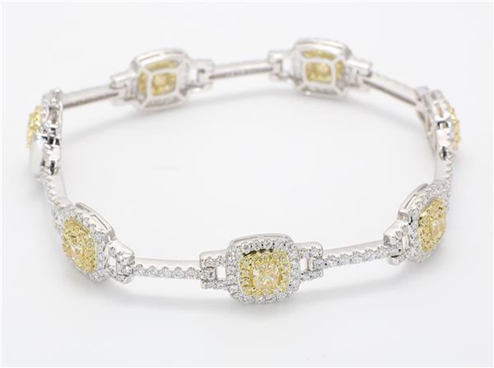 RareGemWorld's classic natural radiant cut yellow diamond bracelet. Mounted in a beautiful 18K Yellow and White Gold setting with 7 natural radiant cut yellow diamonds. The yellow diamonds are surrounded by small round natural white diamond and
