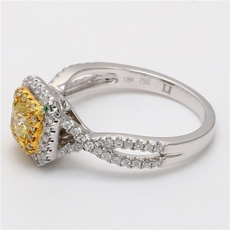 RareGemWorld's classic diamond ring. Mounted in a beautiful 18K Yellow and White Gold setting with a natural radiant cut yellow diamond. The yellow diamond is surrounded by round natural yellow diamond melee and round natural white diamond melee.