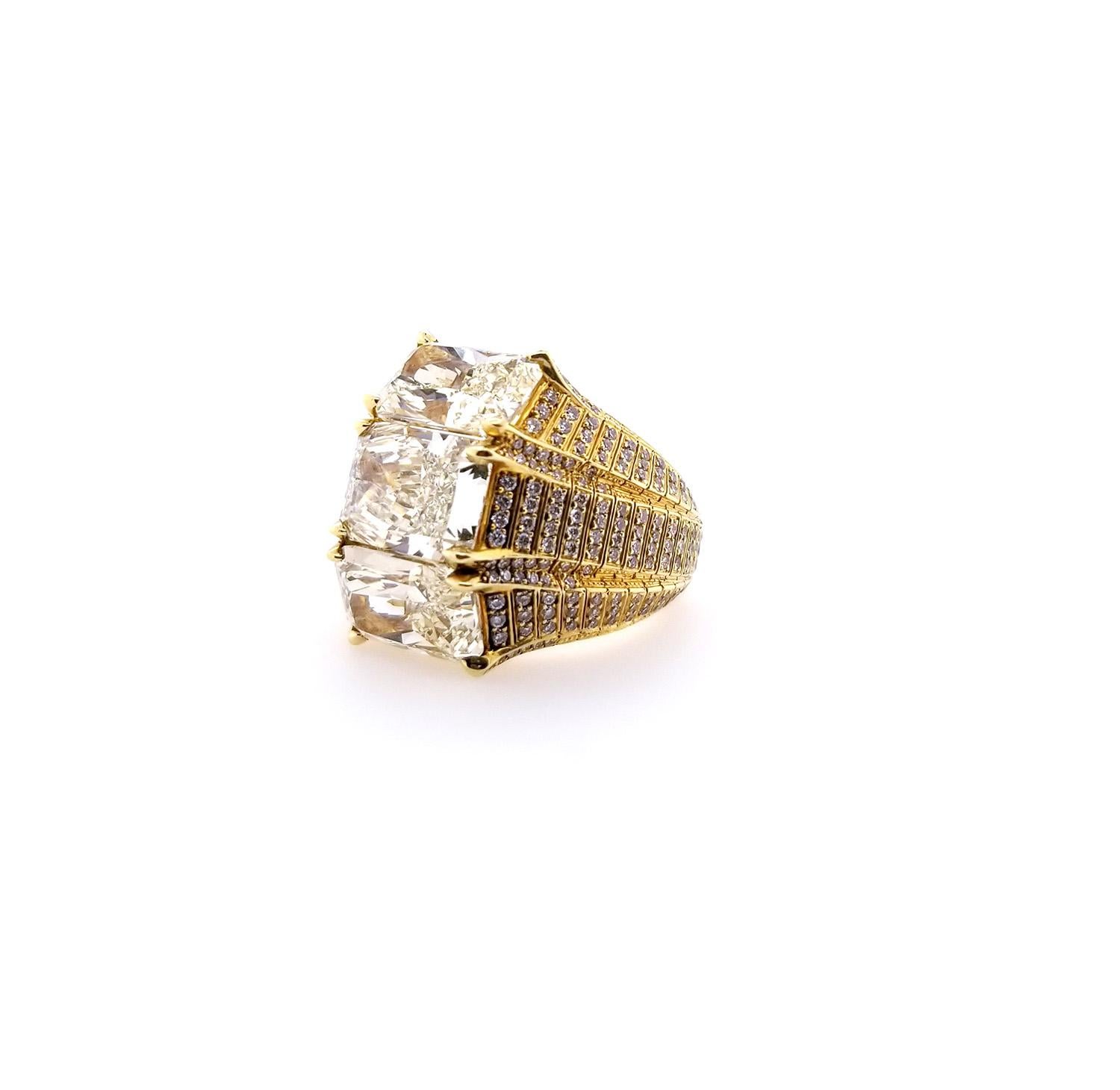 Mounted in 18k yellow gold with full cuts that has a total weight of  1.12 carats. 
3 Yellow Radiant Cut Diamonds  - 7.74 carats total weight
