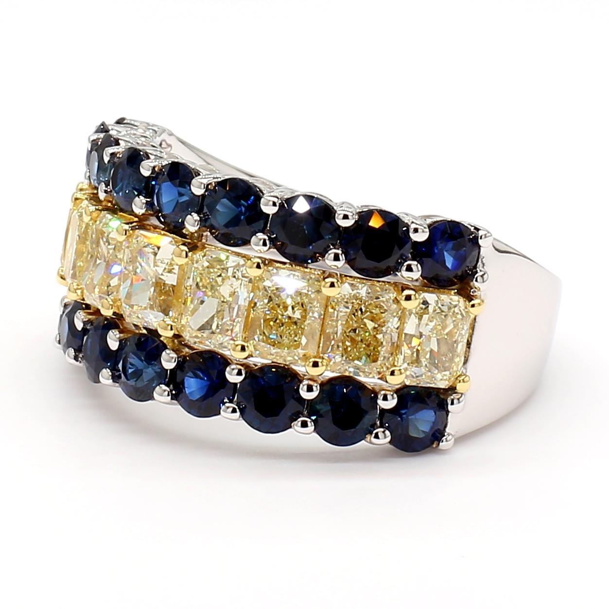 RareGemWorld's intriguing diamond band. Mounted in a beautiful 18K Yellow and White Gold setting with natural radiant cut yellow diamonds complimented by natural round cut blue sapphires. This band is guaranteed to impress and enhance your personal