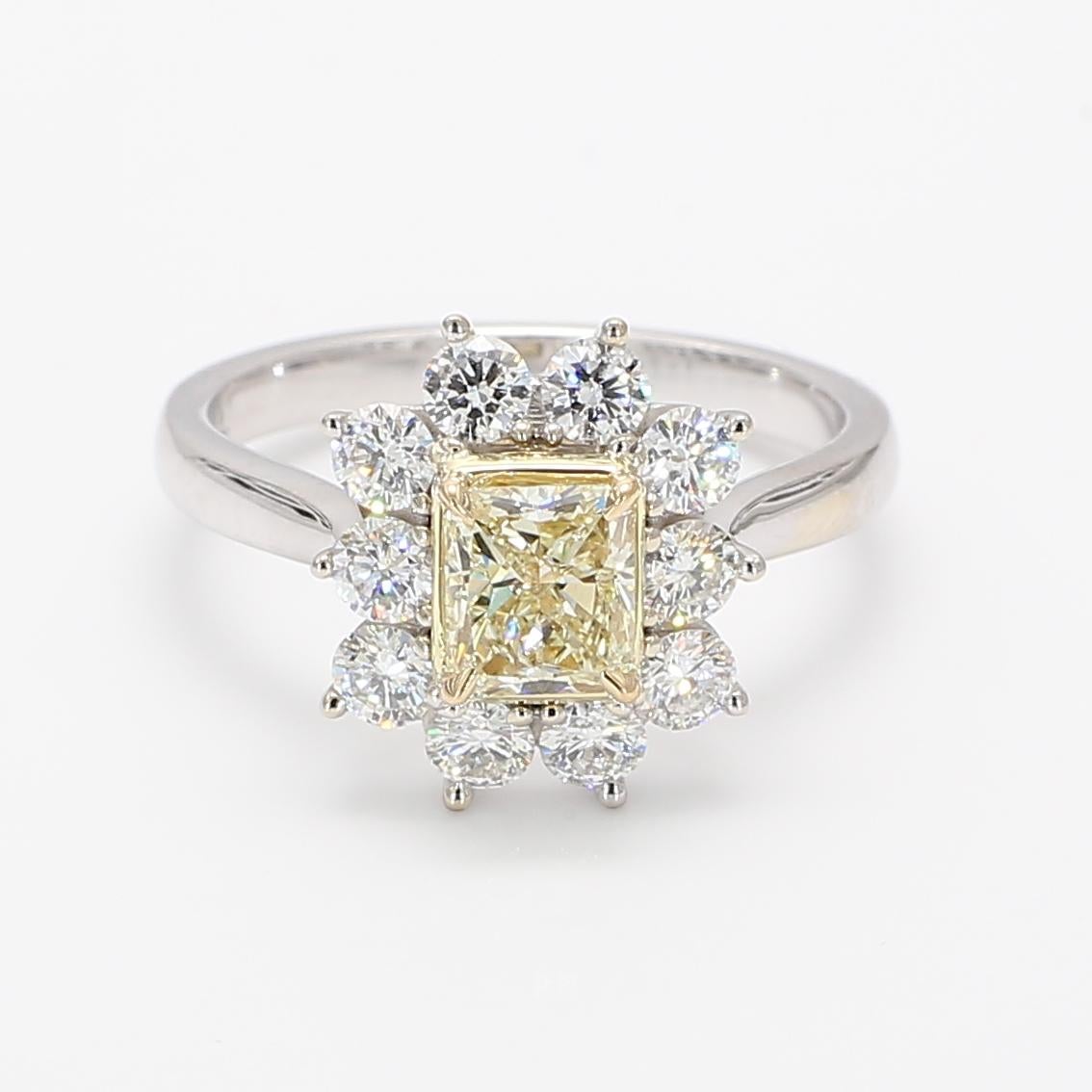 Raregemworld's breathtaking Natural 0.84 cts Yellow Radiant Diamond surrounded by 10 white round diamonds 0.90cts.
Set in 18k White and Yellow Gold

Size 6 1/2 (sizeable upon request)
