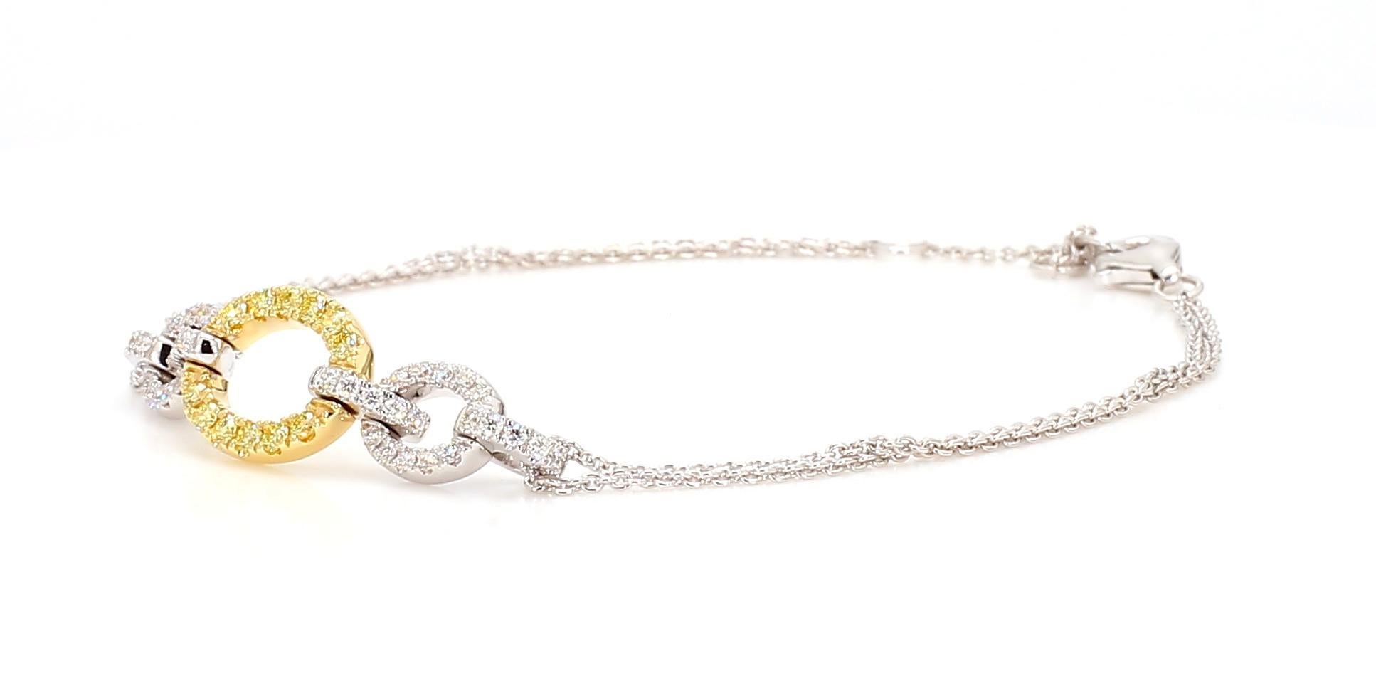 RareGemWorld's beautiful diamond bracelet. Mounted in a beautiful 18K Yellow and White Gold setting with natural round cut yellow diamond melee complimented by natural round cut white diamond melee. This bracelet is guaranteed to impress and will