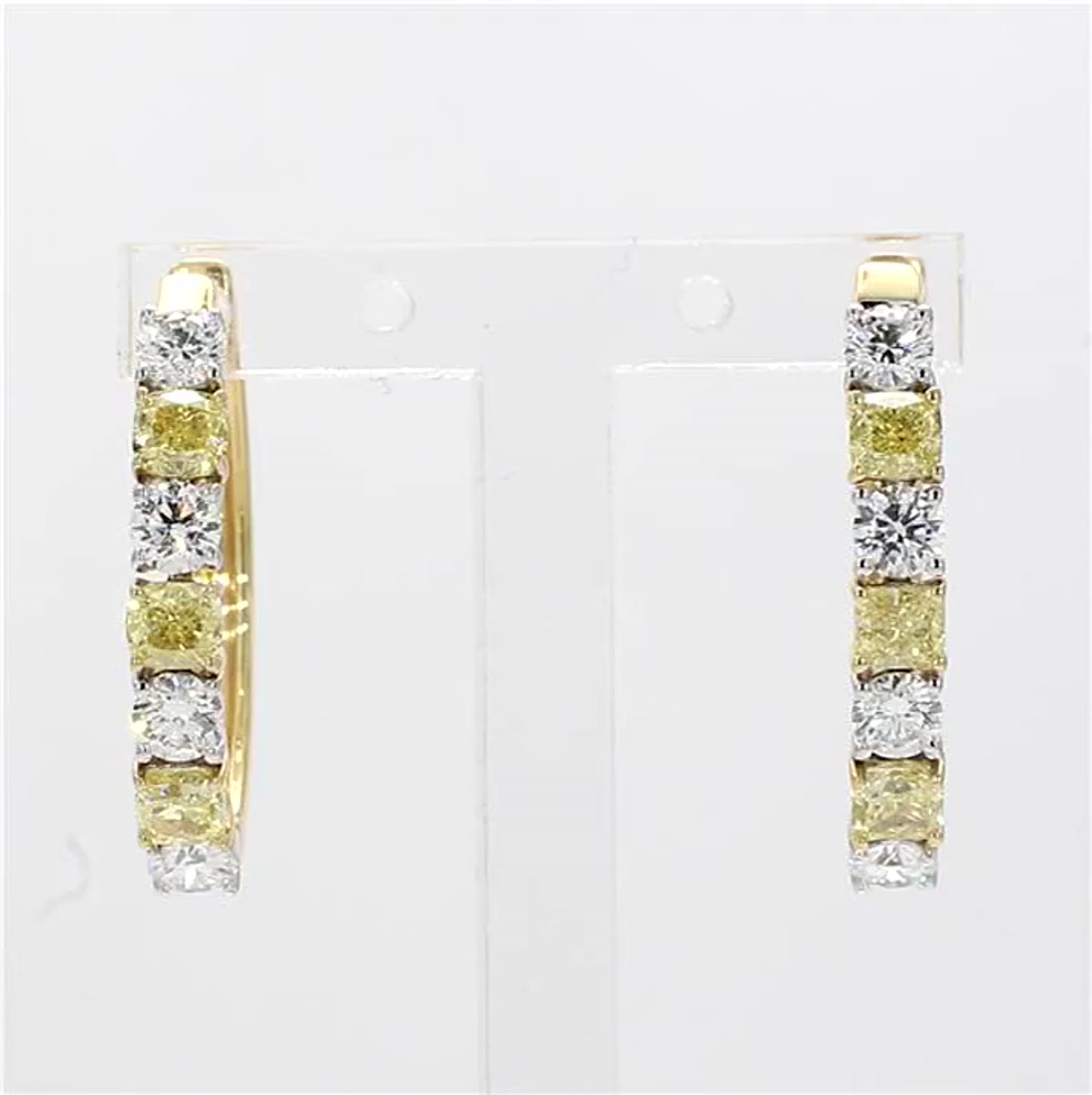 RareGemWorld's classic natural cushion cut yellow diamond earrings. Mounted in a beautiful 18K Yellow and White Gold setting with natural cushion cut yellow diamonds. The yellow diamonds are surrounded by small round natural white diamonds. These